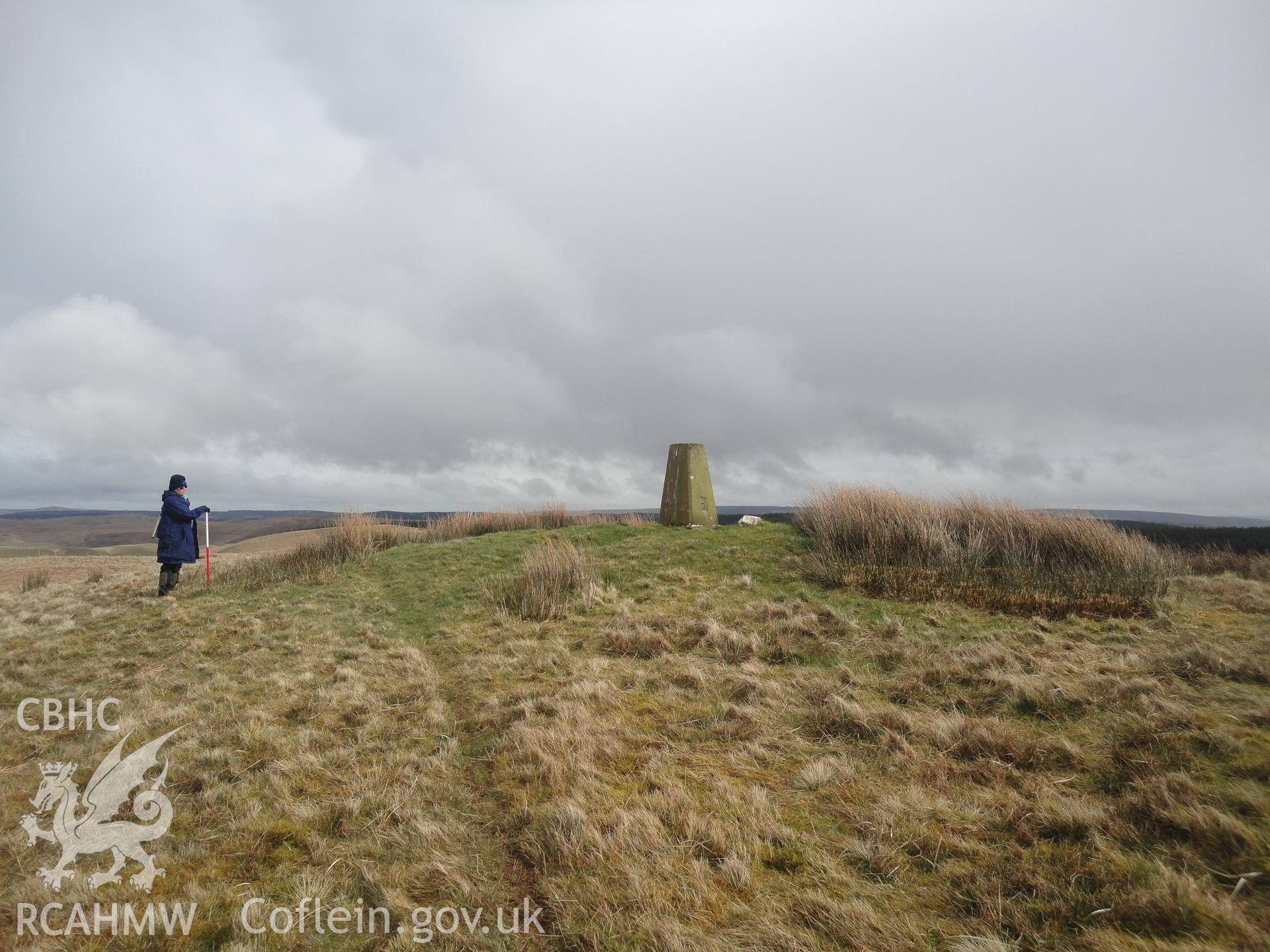 Cairn, with triangulation pillar inserted into the top of it, looking west.