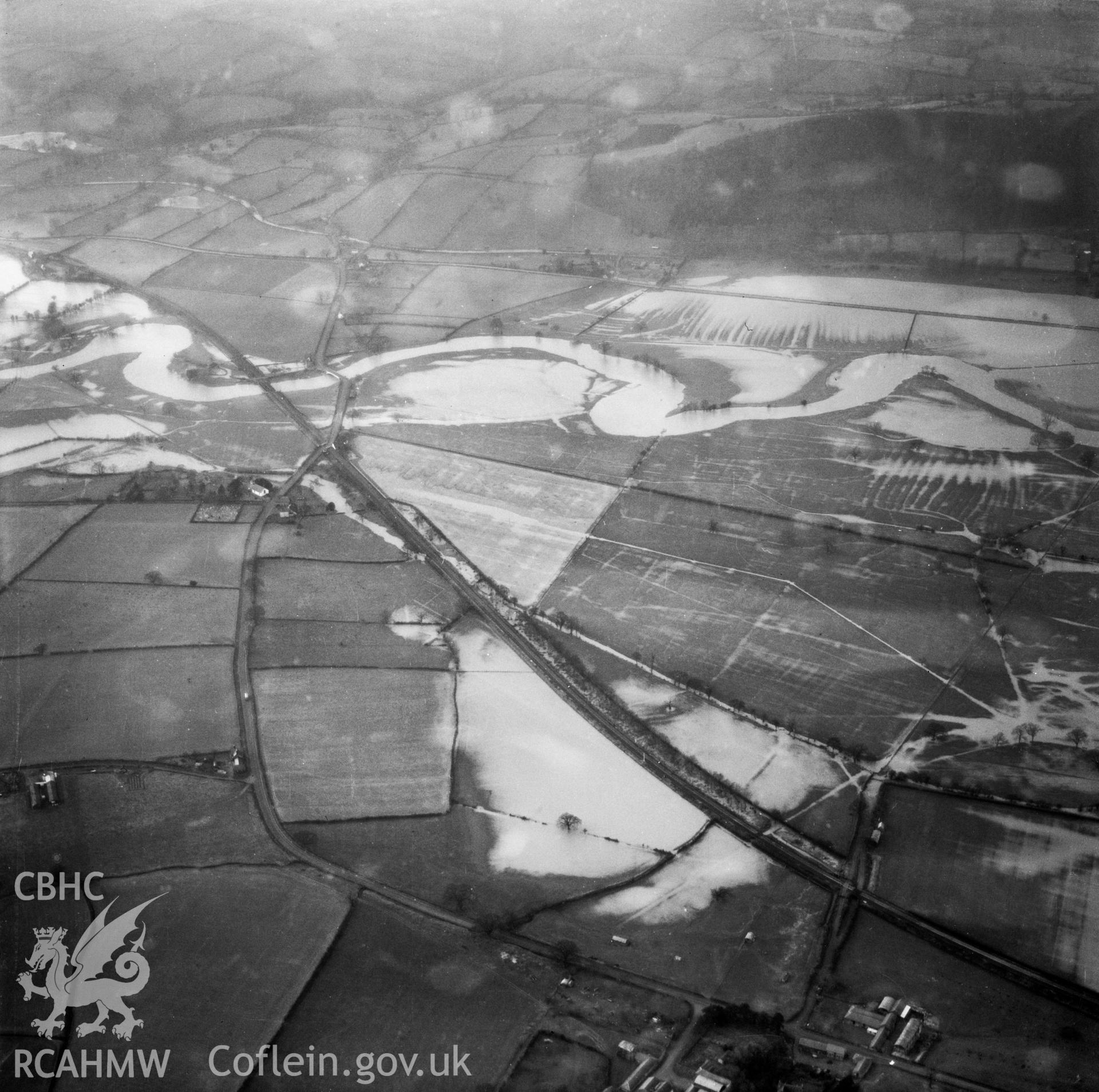 View of the river Severn in flood in the Criggion and Breiddan Hill area. Oblique aerial photograph, 5?" cut roll film.