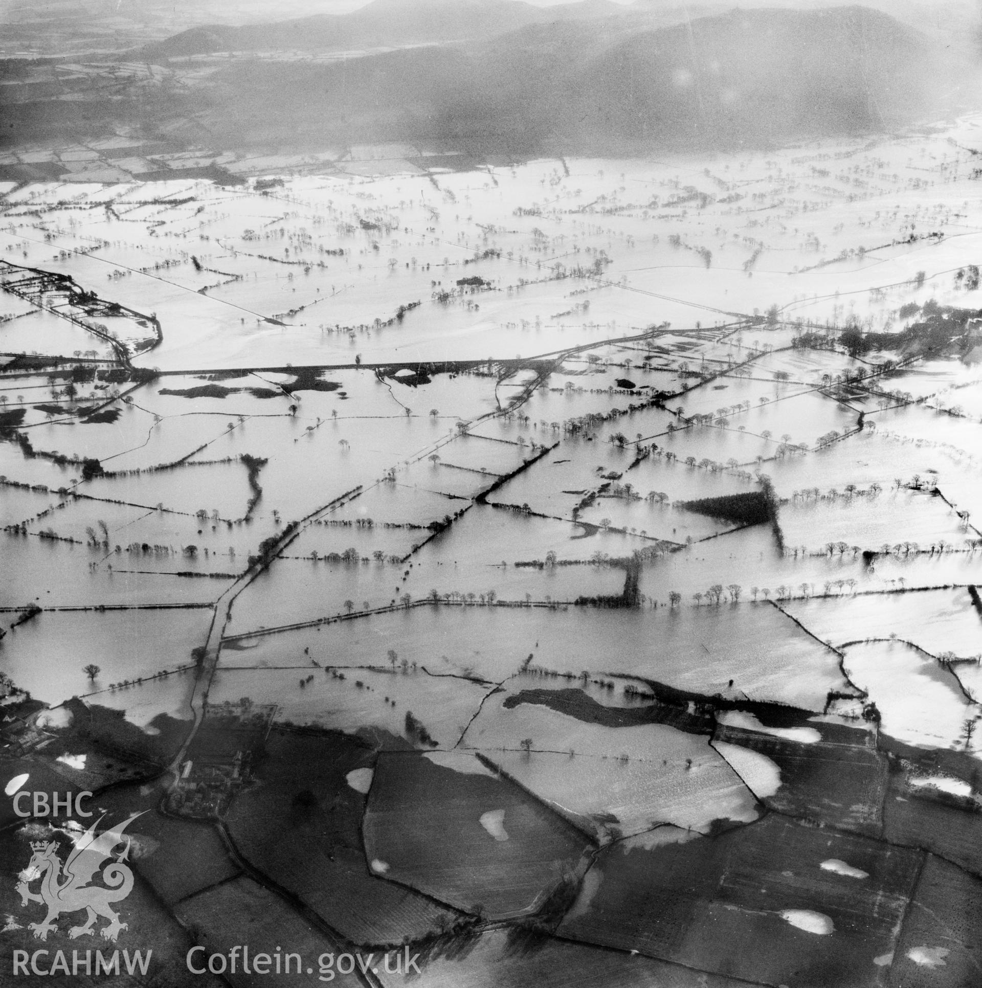 View of the river Severn in flood in the Criggion and Breiddan Hill area. Oblique aerial photograph, 5?" cut roll film.