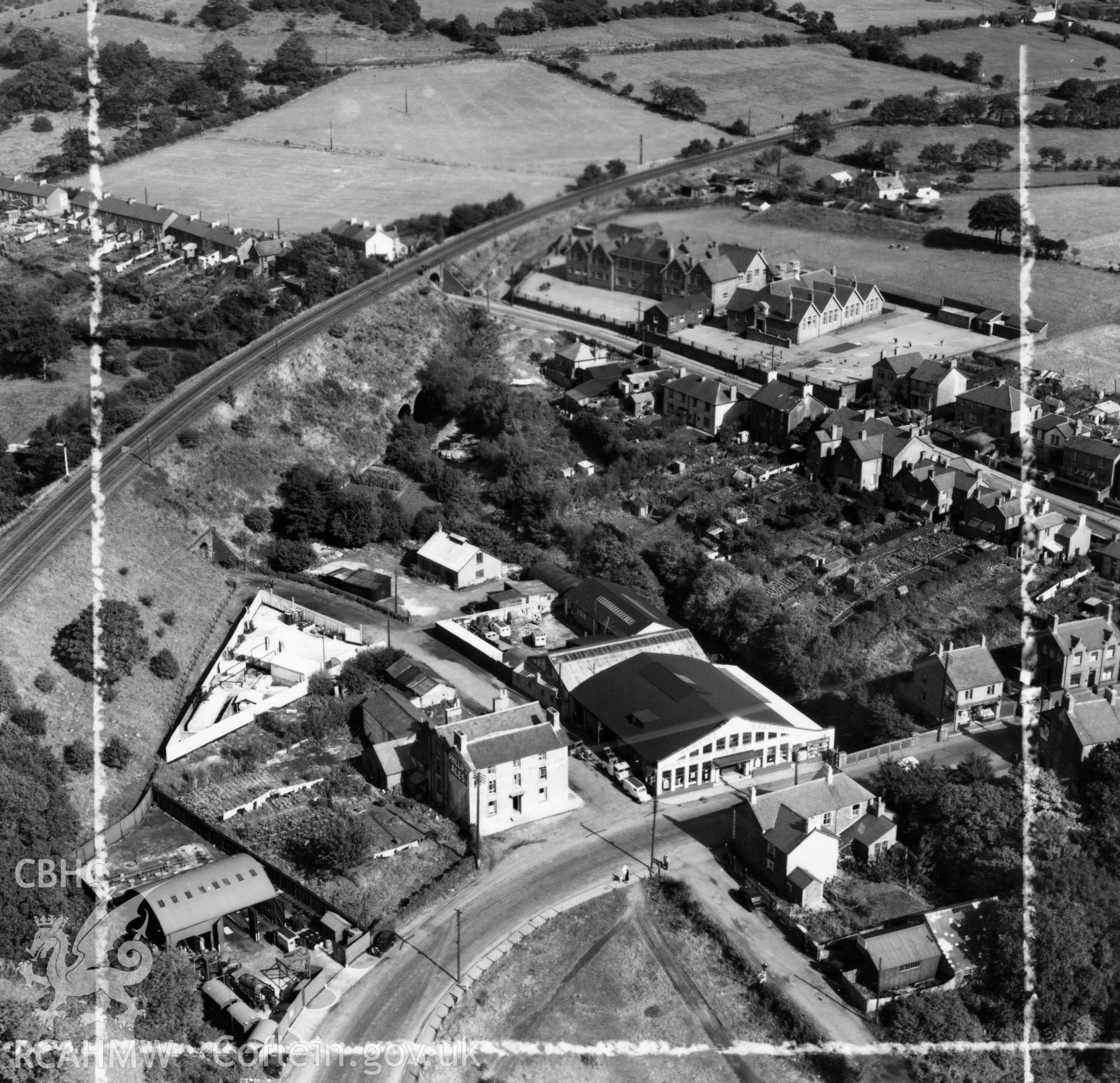 View of Gibbs Brothers garage at Pontllanfraith, also showing schools. Oblique aerial photograph, 5?" cut roll film.