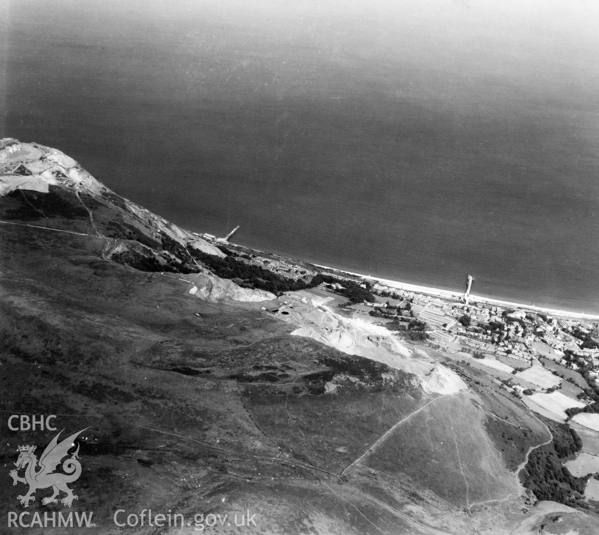 View of Penmaenmawr and Welsh Granite Co. Ltd. Quarries at Penmaenmawr. Oblique aerial photograph, 5?" cut roll film.