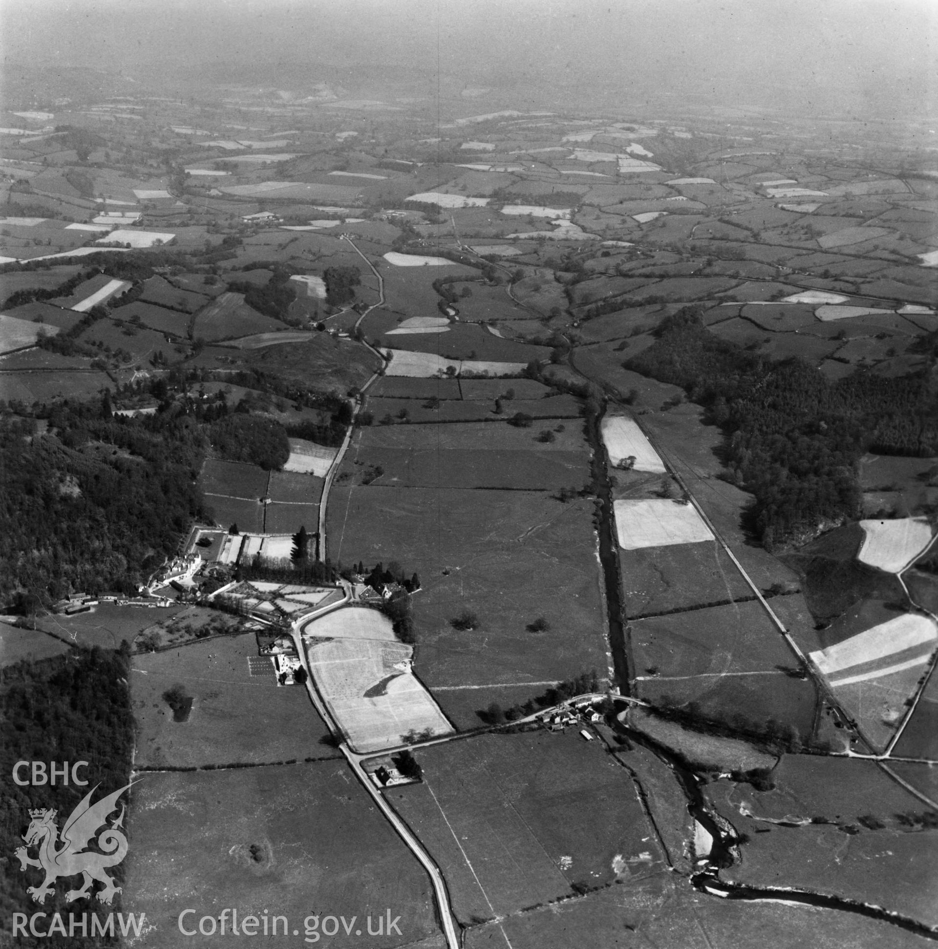 View of the Tanat valley showing railway, Llangedwyn Hall garden and Llangedwyn Bridge. Oblique aerial photograph.