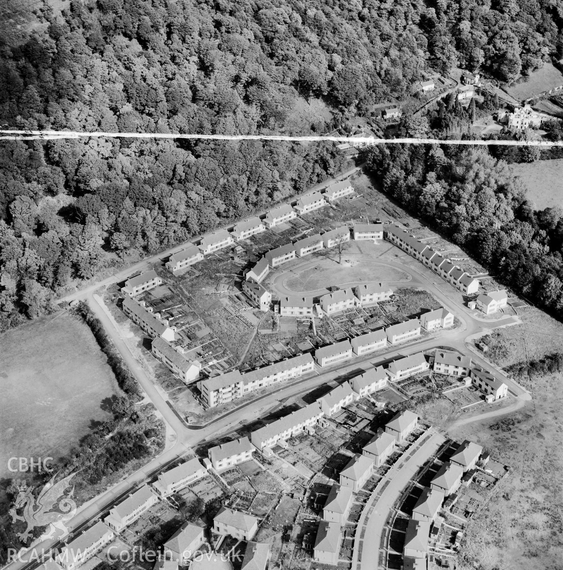 View of new-built housing estate at Baglan showing distant view of Baglan House in ruins