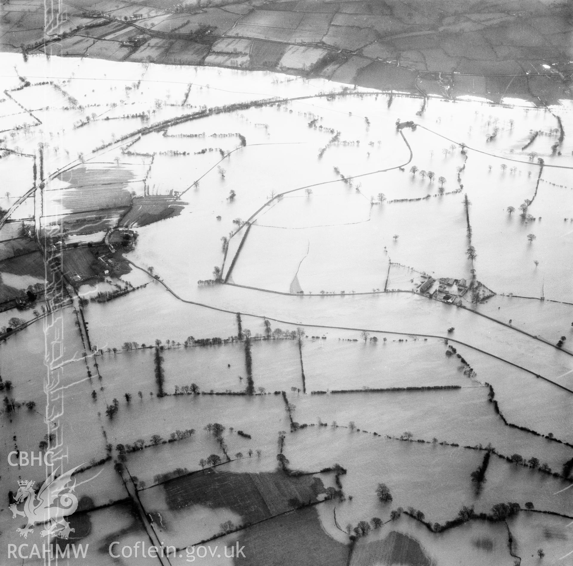 View of the river Severn in flood in the Criggion and Breiddan Hill area. Oblique aerial photograph, 5?" cut roll film.