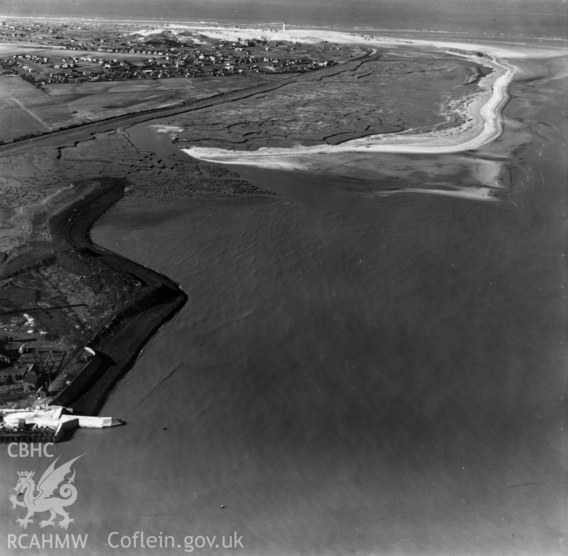 View of the Point of Ayr colliery landing stage and Point of Ayr lighthouse with caravans. Oblique aerial photograph, 5?" cut roll film.