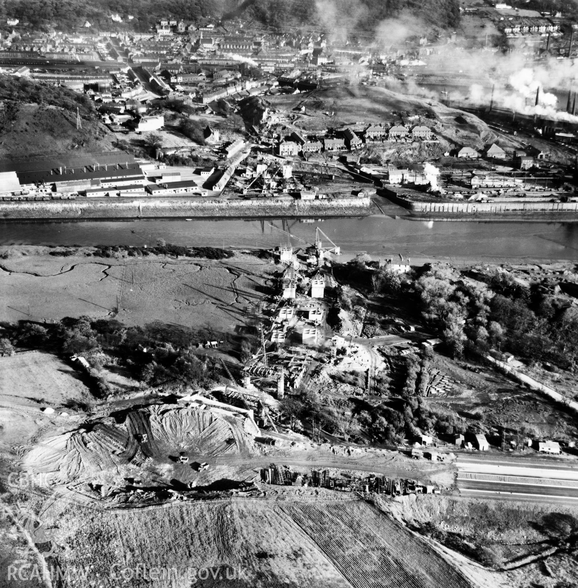 View of the Cleveland Bridge & Engineering Co. Ltd. bridge under construction at Briton Ferry. Oblique aerial photograph, 5?" cut roll film.