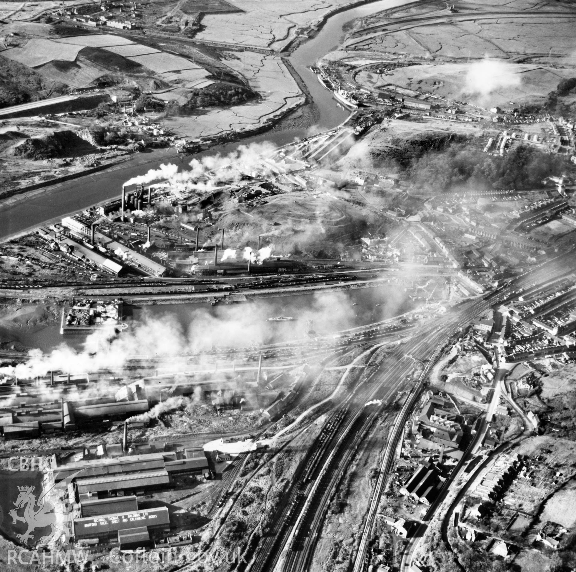 View of Briton Ferry and the Cleveland Bridge under construction. Oblique aerial photograph, 5?" cut roll film.