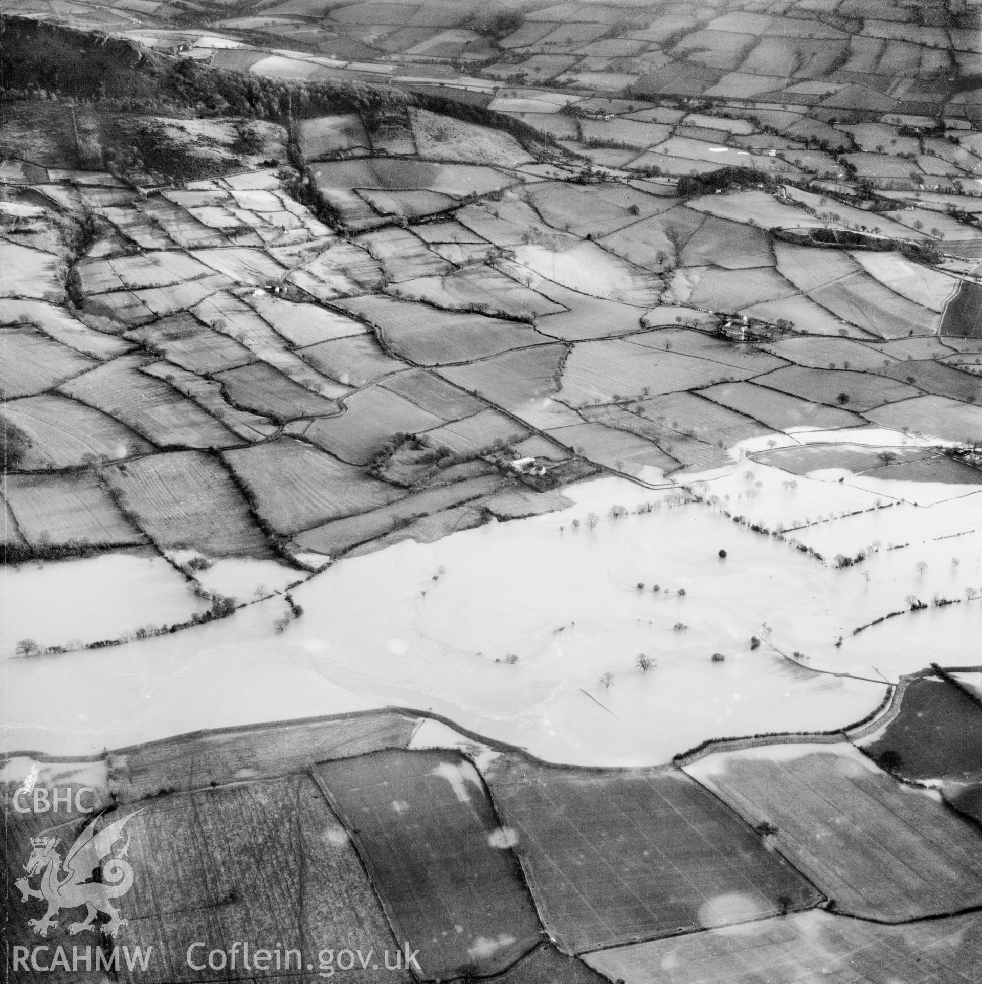 View of the river Severn in flood in the Criggion and Breiddan Hill area. Oblique aerial photograph, 5?" cut roll film.