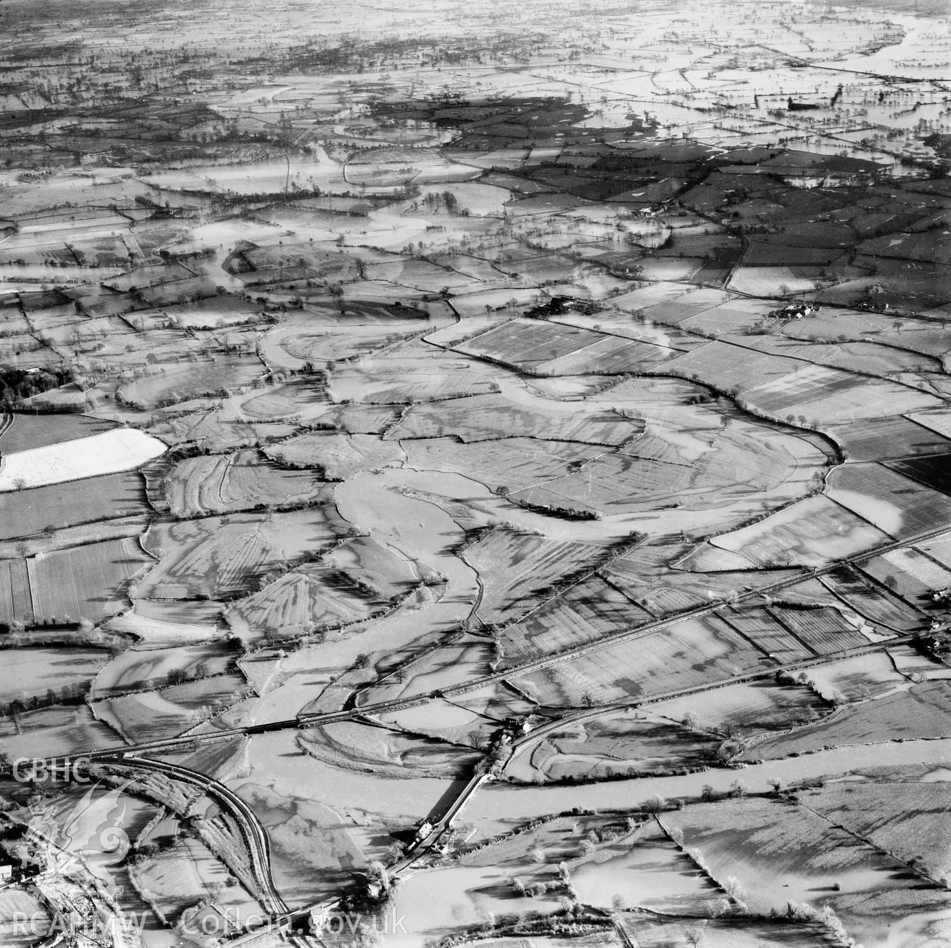 View of the river Severn in flood in the Criggion and Breiddan Hill area. Oblique aerial photograph, 5?" cut roll film.