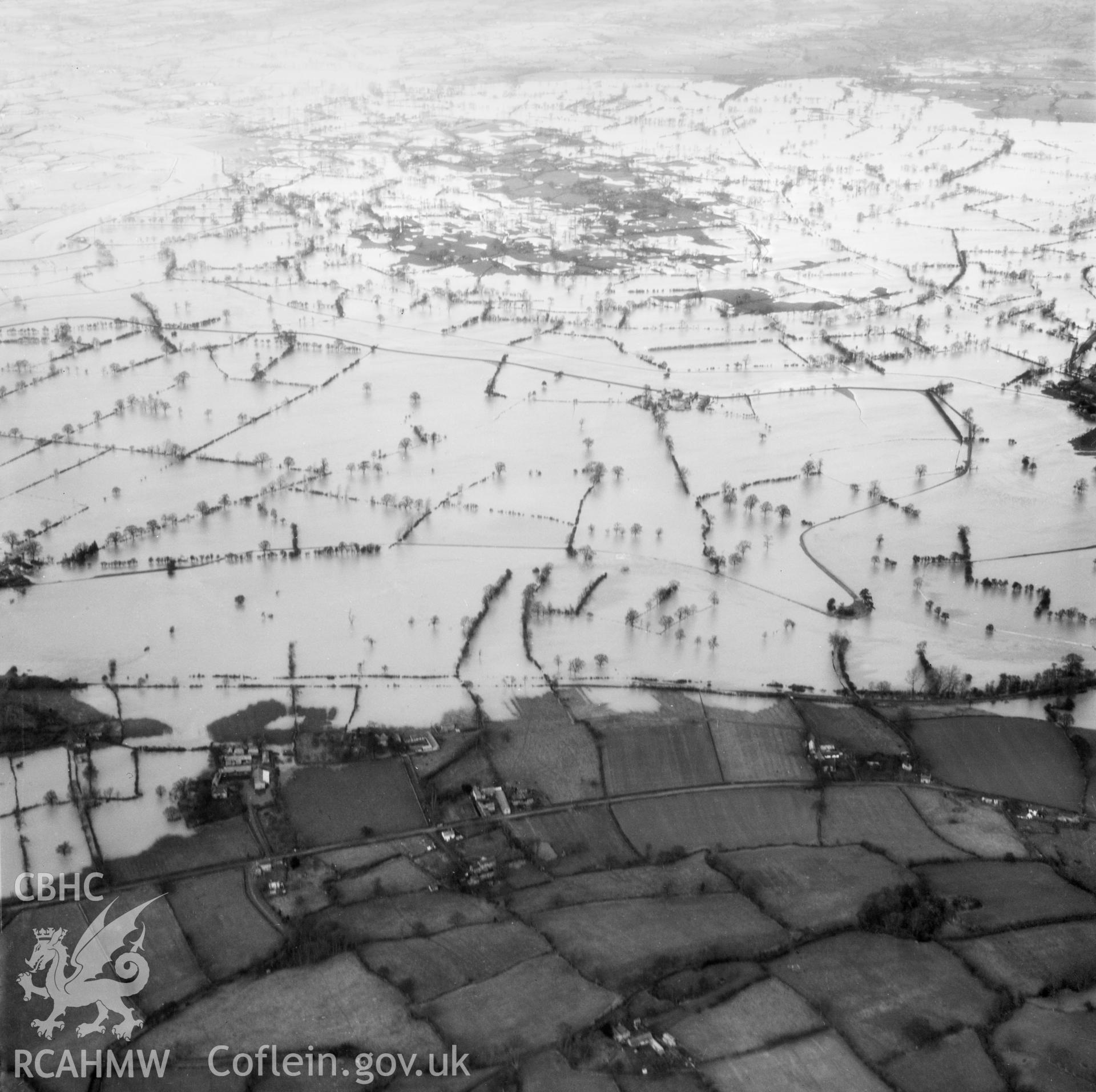 View of the river Severn in flood in the Criggion and Breiddan Hill area. Oblique aerial photograph, 5?" cut roll film.