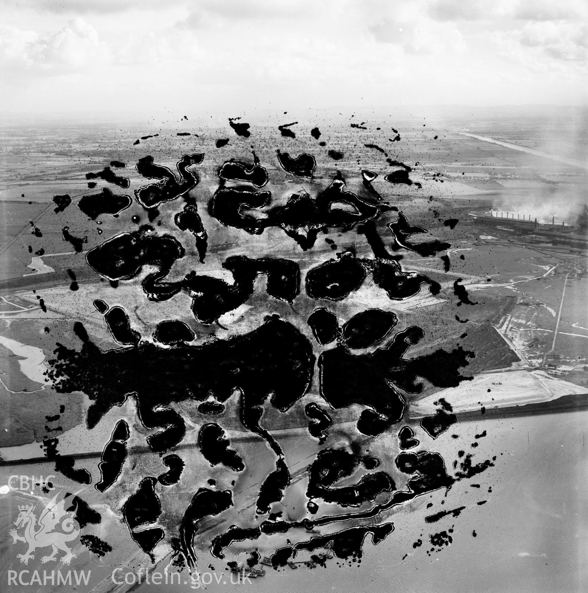 View of the dredging of the Shotton steelworks site (commissioned by Westminster Dredging Co.). Oblique aerial photograph, 5?" cut roll film.