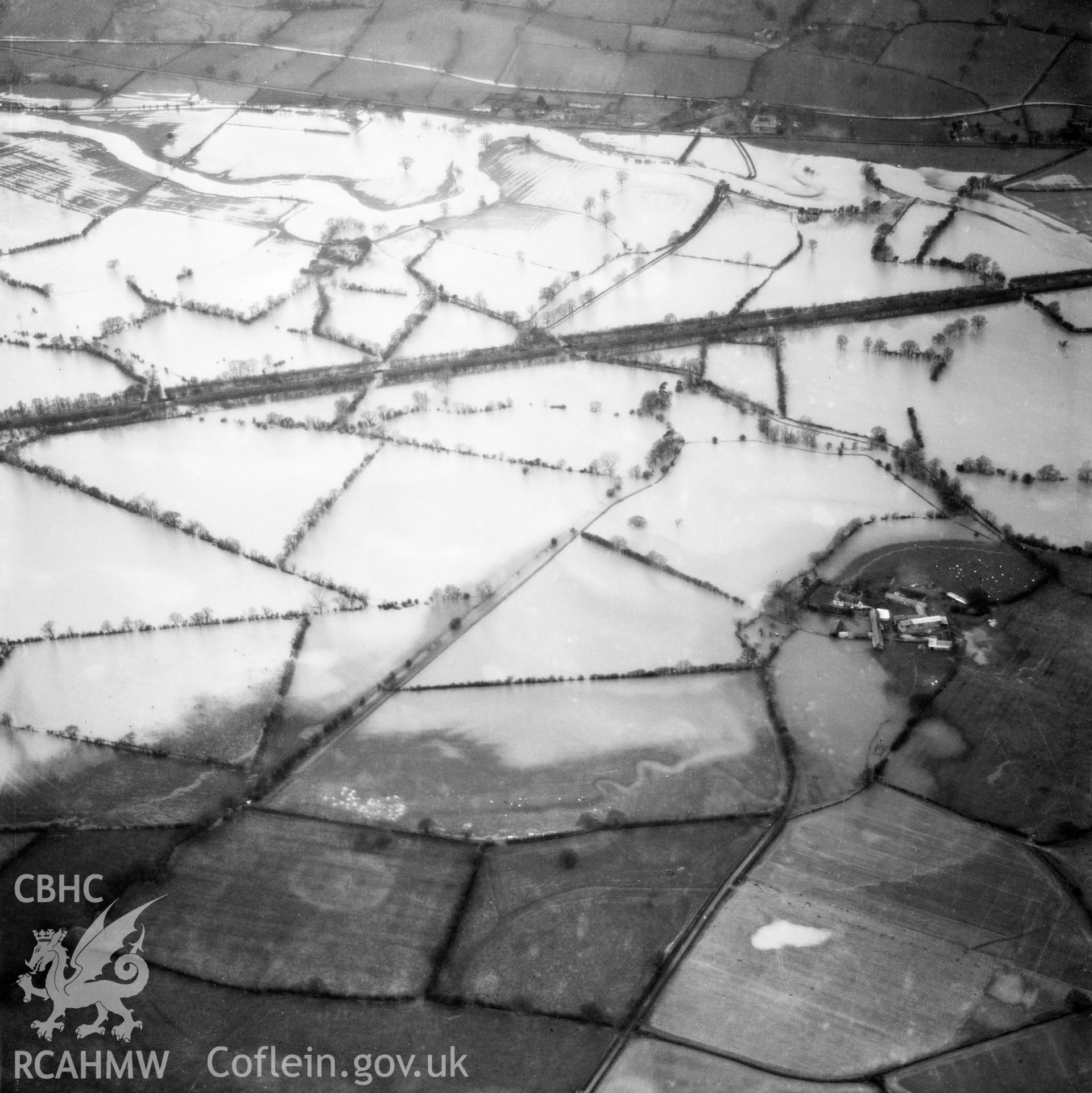 View of the river Severn in flood in the Criggion and Breiddan Hill area. Oblique aerial photograph, 5?" cut roll film.