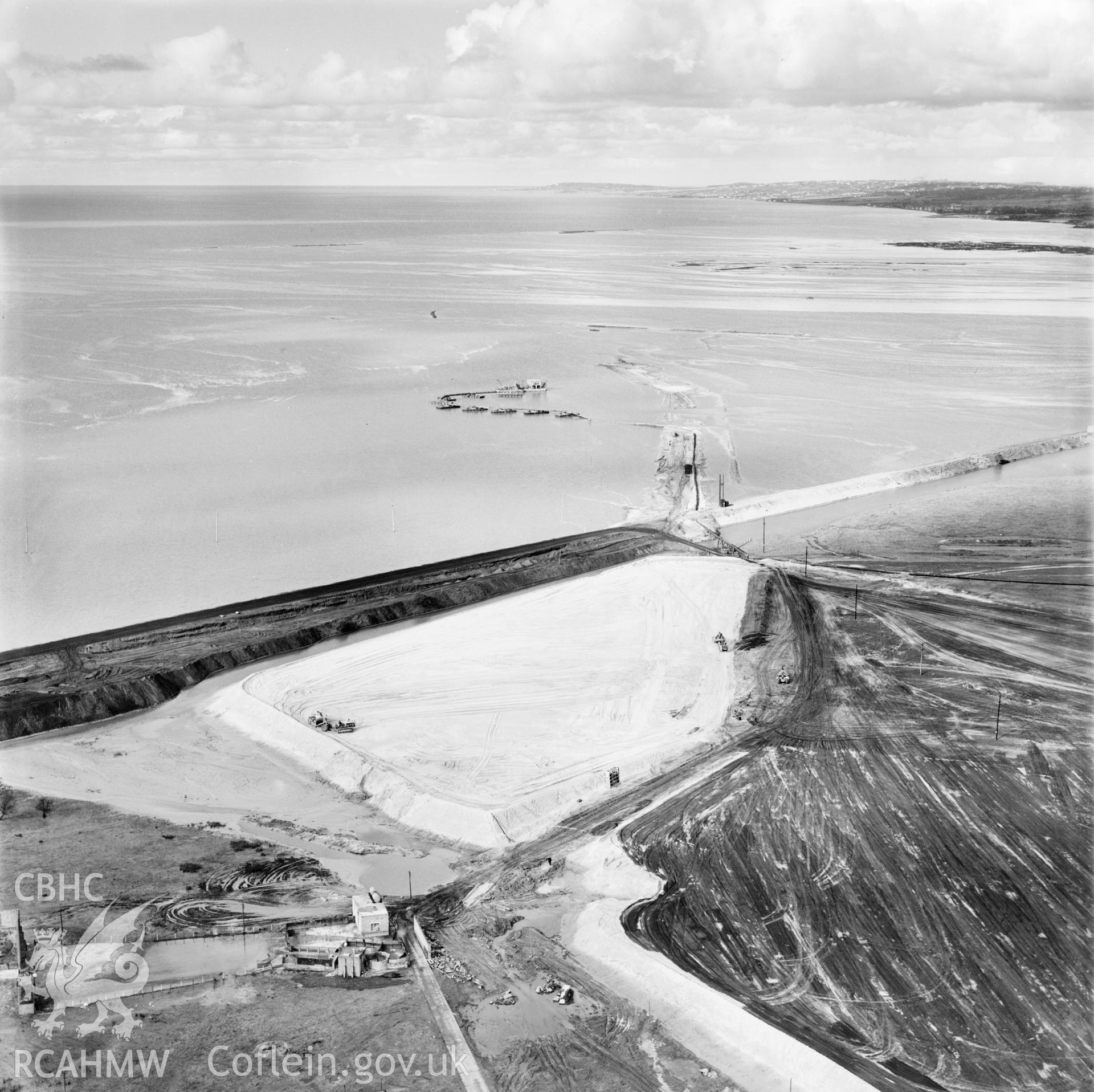 View of the dredging of the Shotton steelworks site (commissioned by Westminster Dredging Co.). Oblique aerial photograph, 5?" cut roll film.