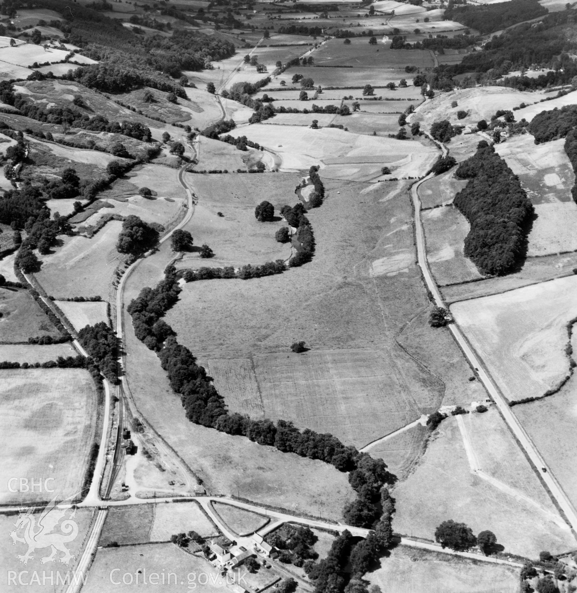 View of the Tanat valley showing railway and halt near Llanerch Emrys. Oblique aerial photograph.