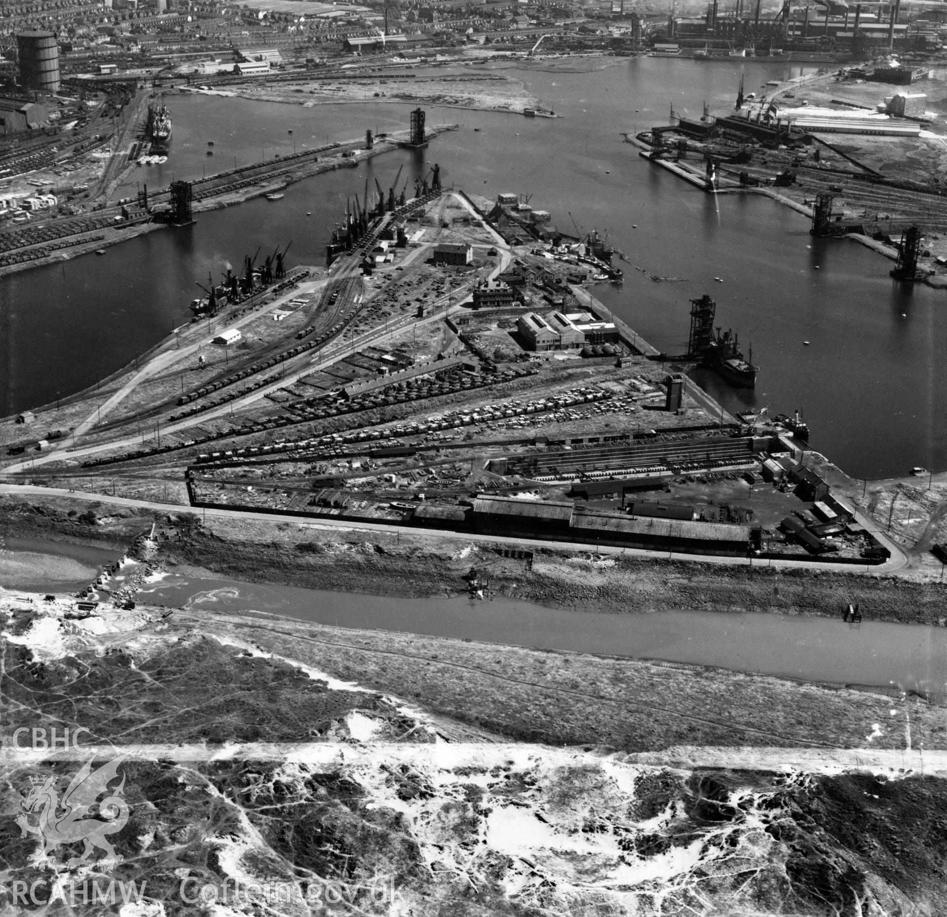 View of dry, new and old docks and entrance channel, Port Talbot. Oblique aerial photograph, 5?" cut roll film.