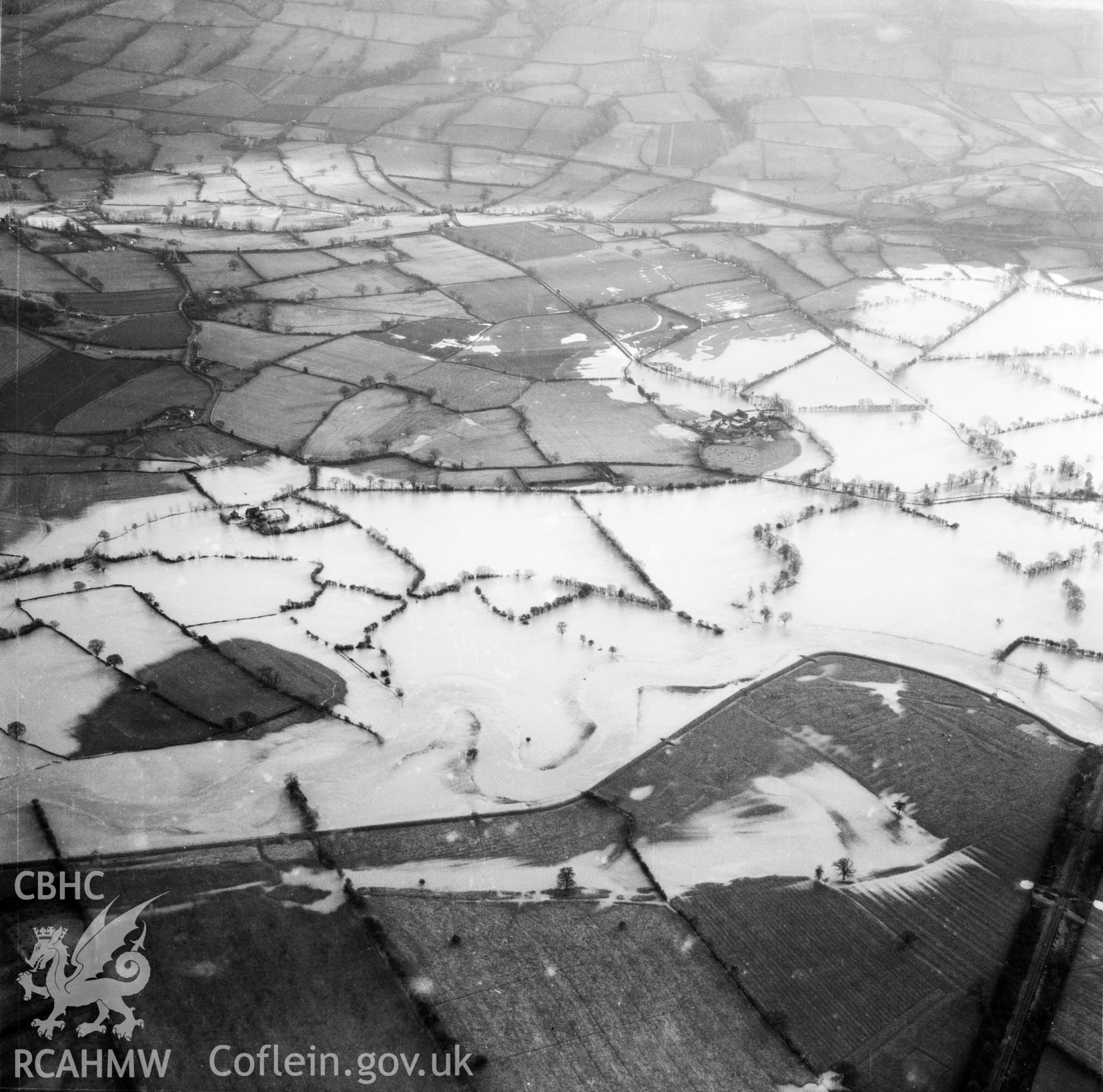 View of the river Severn in flood in the Criggion and Breiddan Hill area. Oblique aerial photograph, 5?" cut roll film.