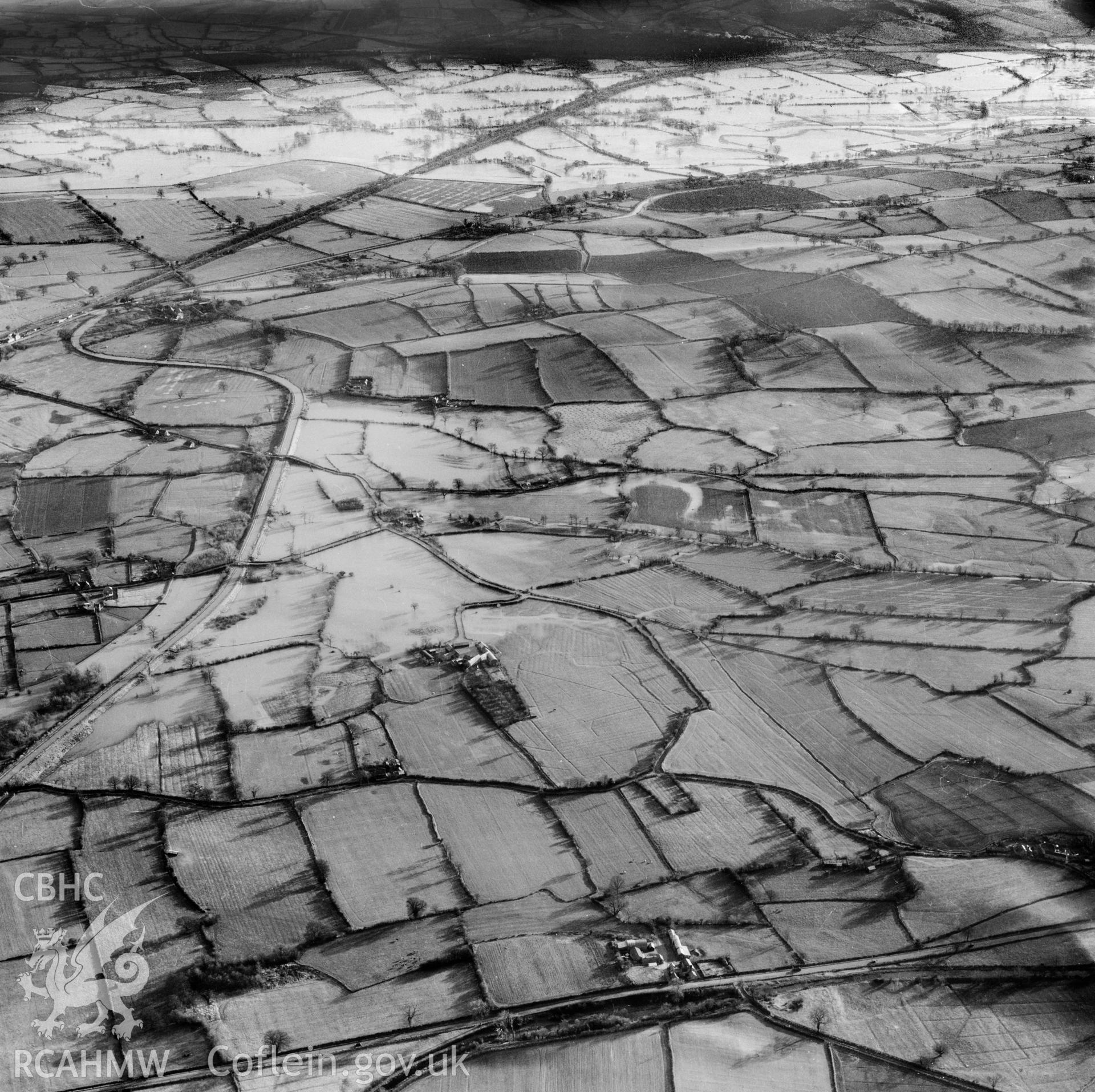 View of the river Severn in flood in the Criggion and Breiddan Hill area. Oblique aerial photograph, 5?" cut roll film.