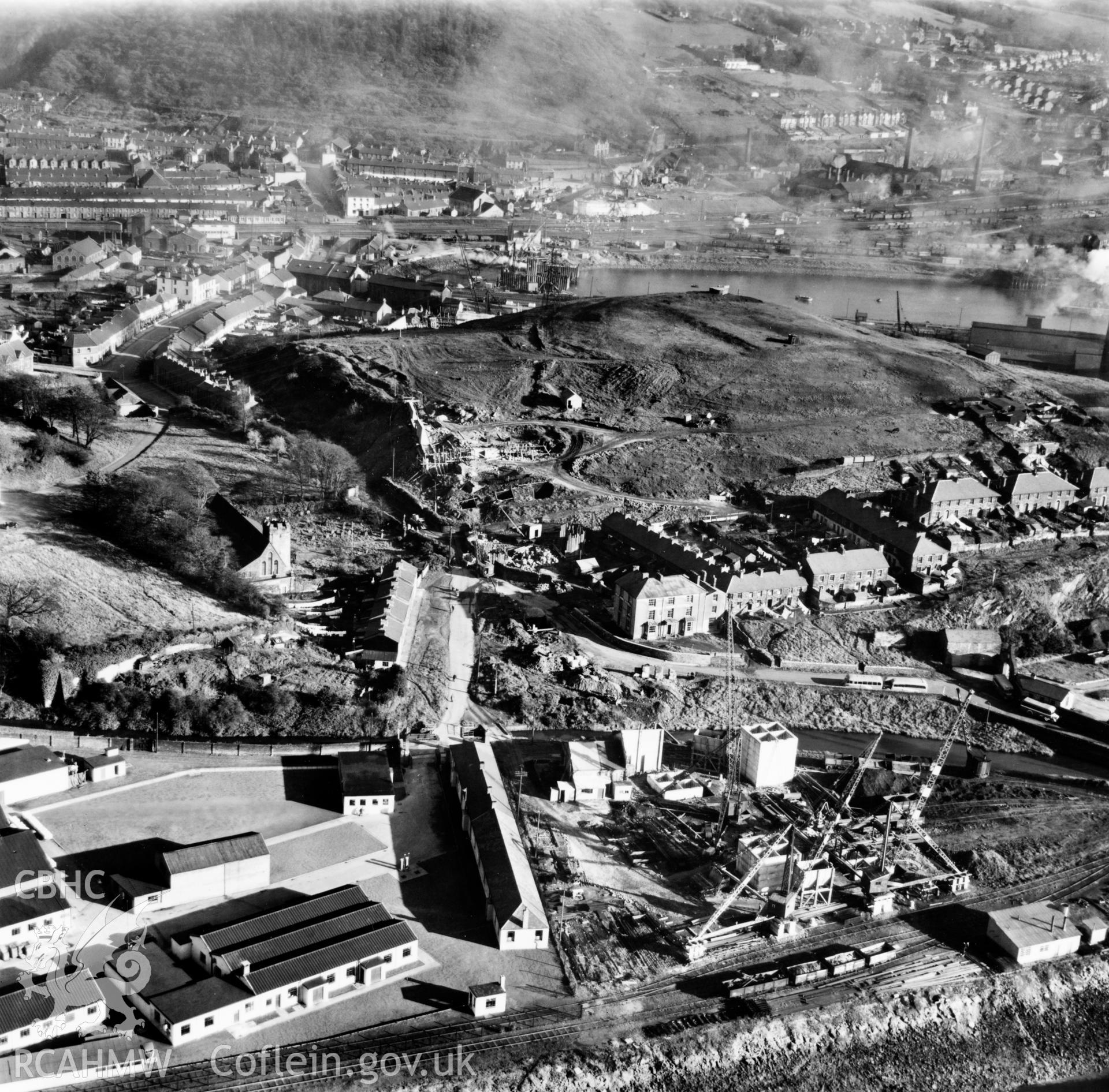 View of Briton Ferry and the Cleveland Bridge under construction. Oblique aerial photograph, 5?" cut roll film.