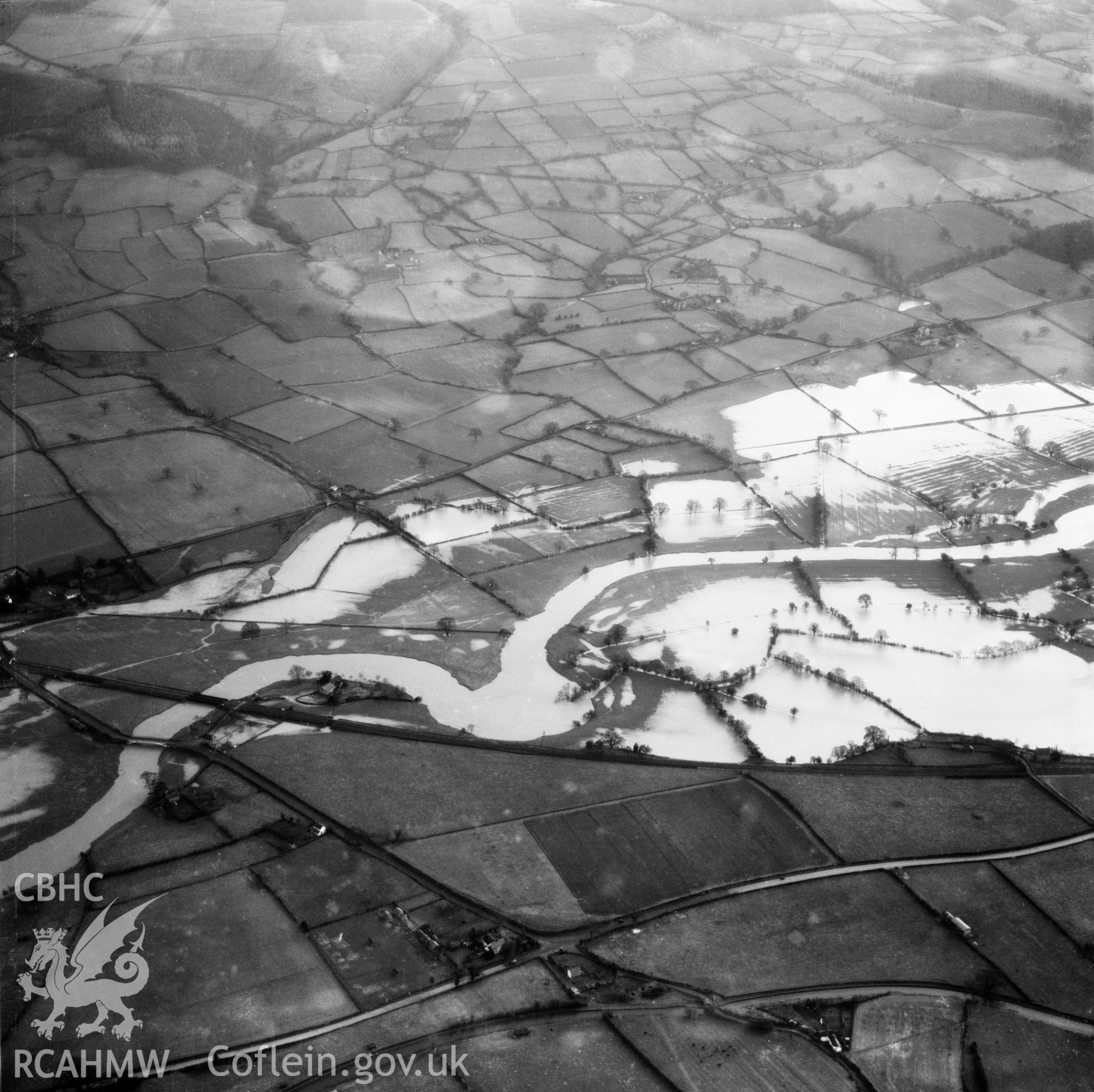 View of the river Severn in flood in the Criggion and Breiddan Hill area. Oblique aerial photograph, 5?" cut roll film.