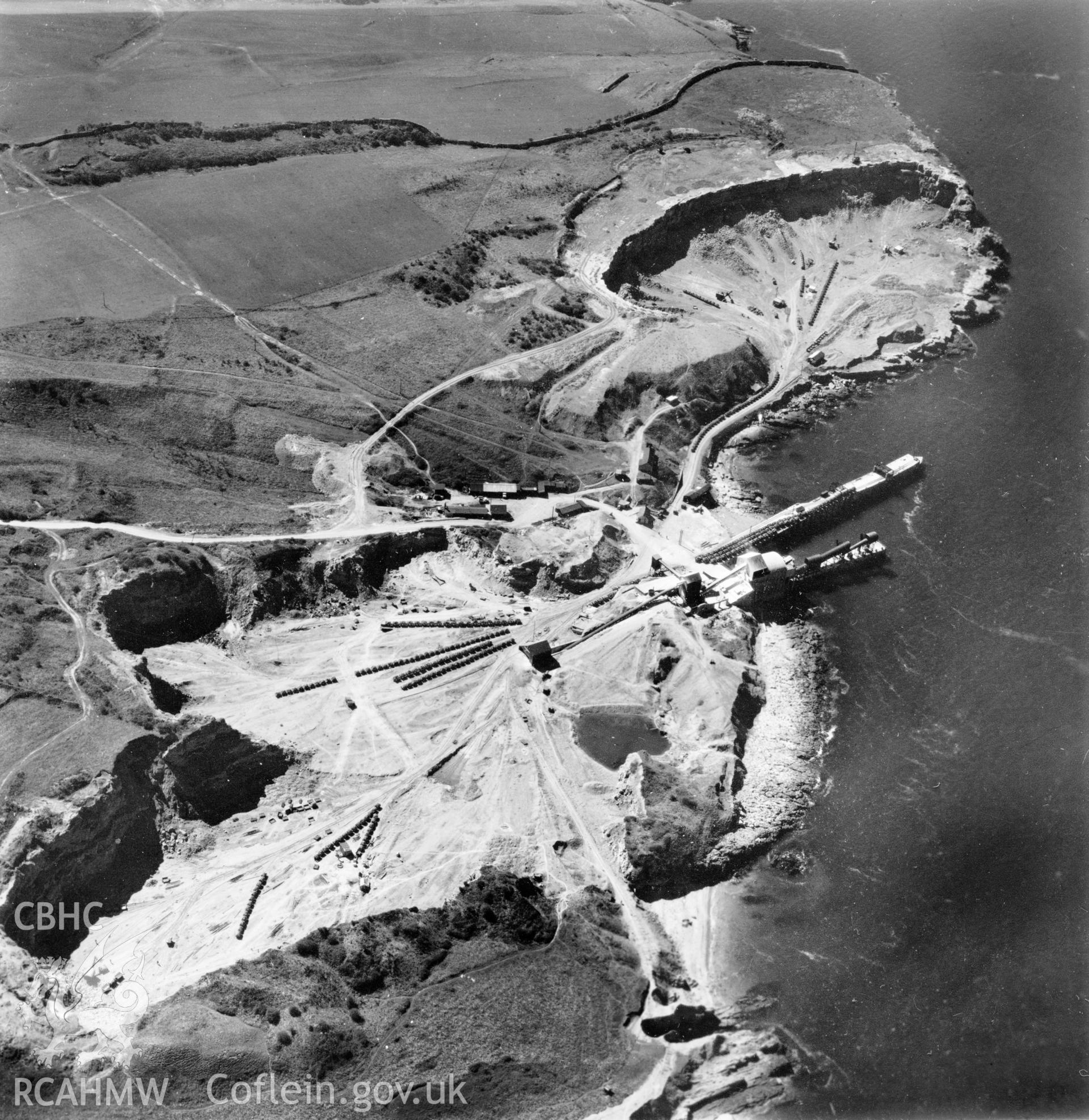 View of Dinmor Park Quarry, Anglesey, commissioned by Cawood Wharton & Co. Ltd.. Oblique aerial photograph, 5?" cut roll film.
