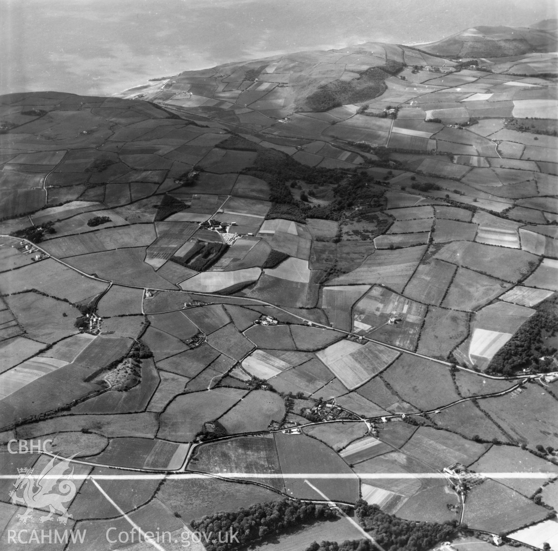 Wide view of landscape around Frongoch, the site of the Agricultural college, commissioned by J.E. Nichols. Oblique aerial photograph, 5?" cut roll film.