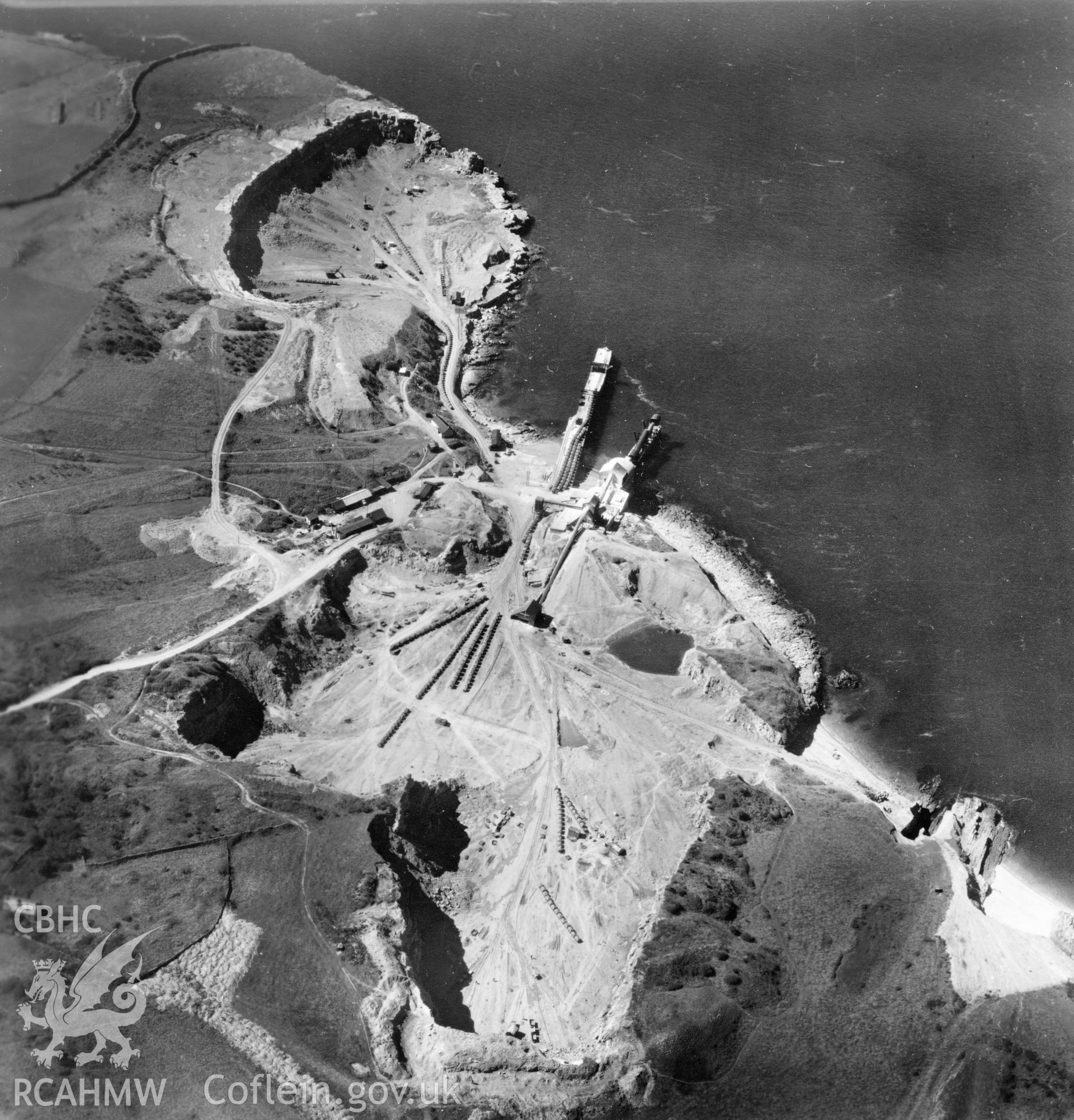 View of Dinmor Park Quarry, Anglesey, commissioned by Cawood Wharton & Co. Ltd.. Oblique aerial photograph, 5?" cut roll film.