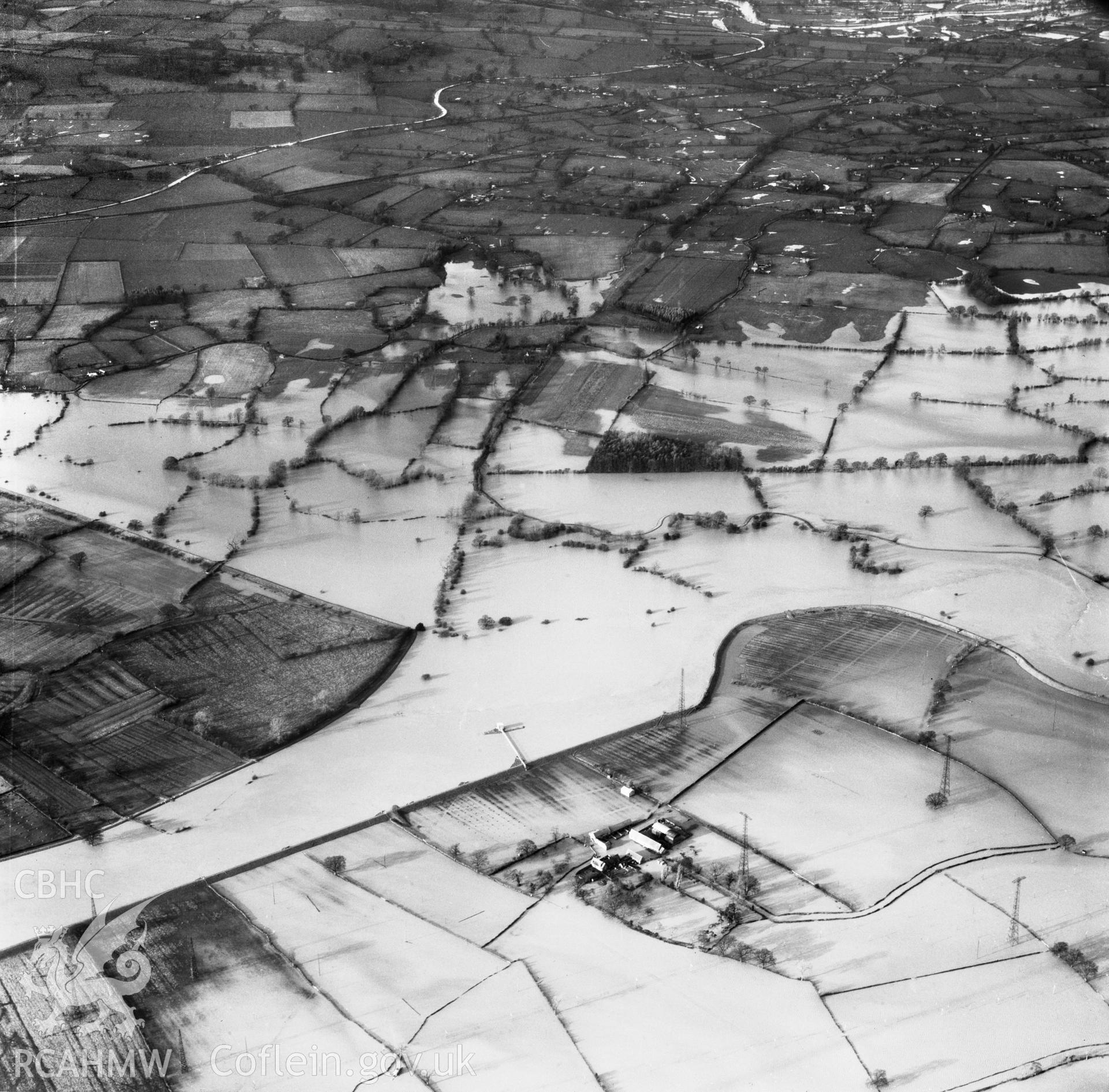 View of the river Severn in flood in the Criggion and Breiddan Hill area. Oblique aerial photograph, 5?" cut roll film.