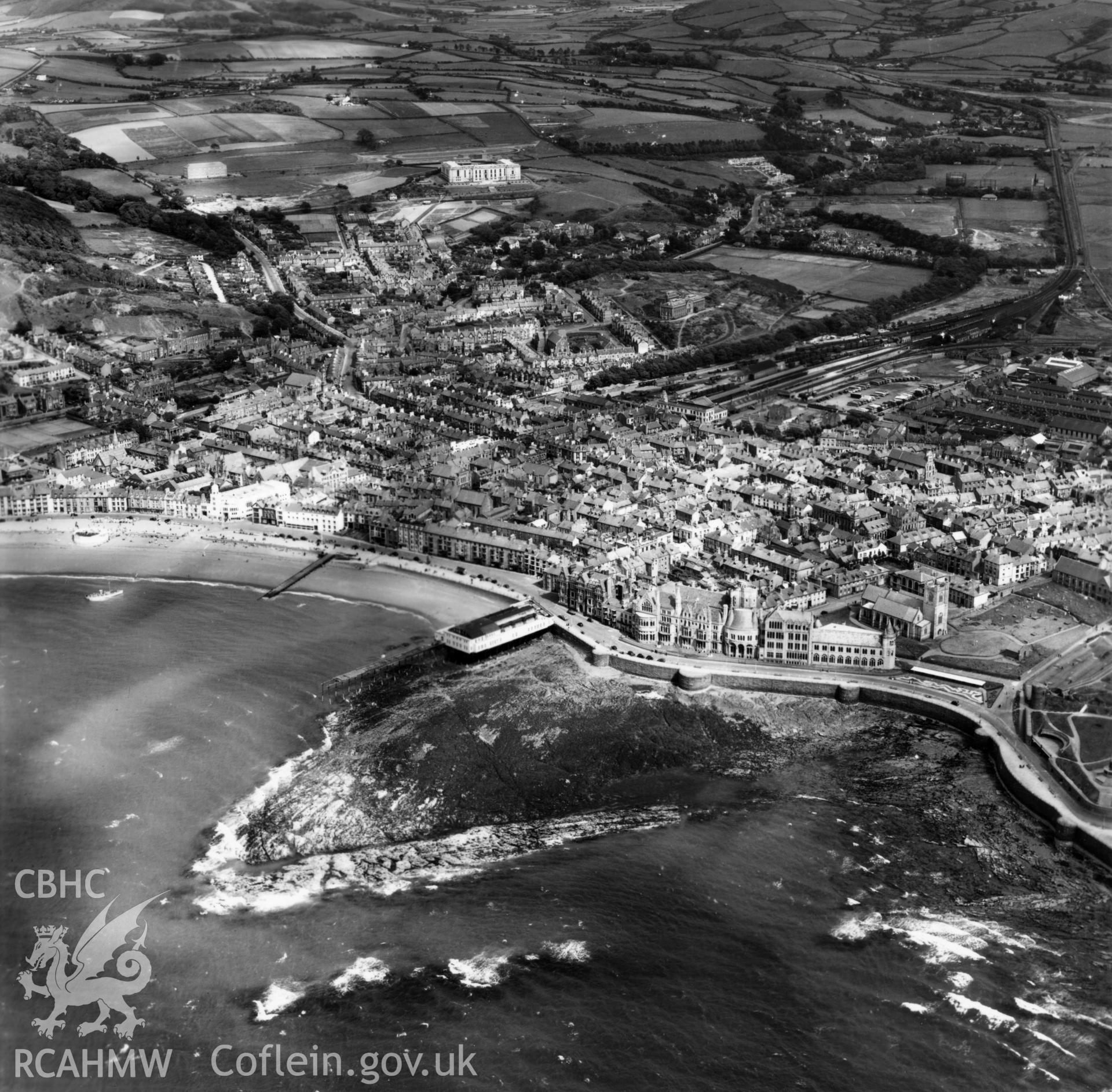 General view of Aberystwyth from the seafront looking east. Oblique aerial photograph, 5?" cut roll film.
