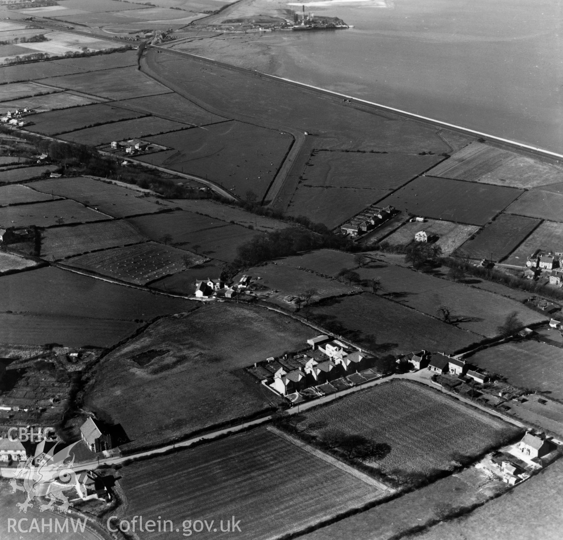 View of Ffynnongroyw showing Pen-y-ffordd in the foreground and disused tramway to Point of Ayr colliery in the background. Oblique aerial photograph, 5?" cut roll film.
