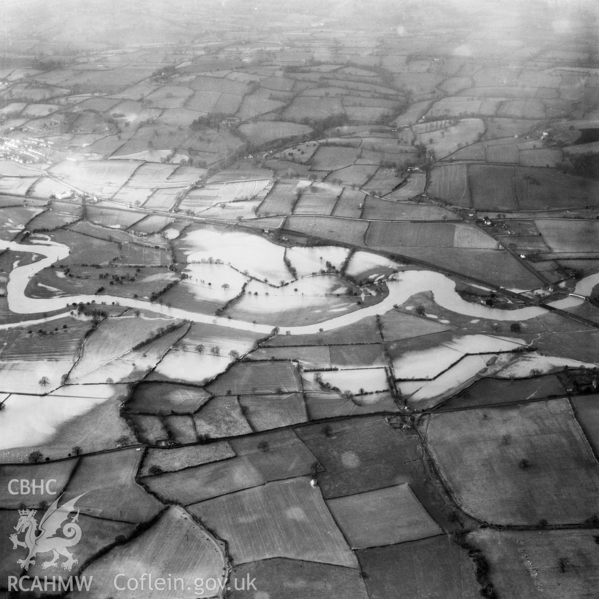 View of the river Severn in flood in the Criggion and Breiddan Hill area. Oblique aerial photograph, 5?" cut roll film.