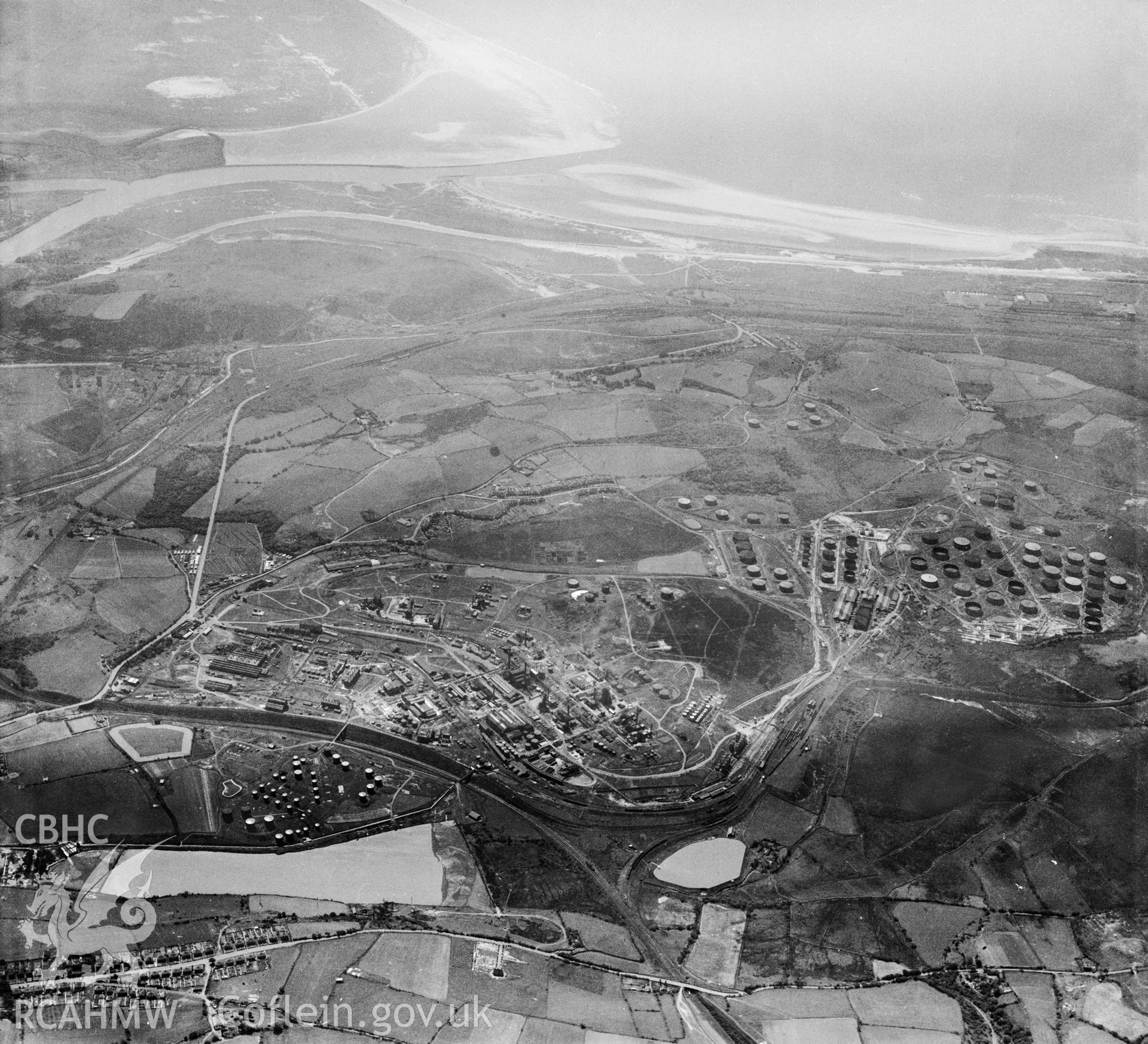 General view of the Anglo Iranian oil refinery, Llandarcy, with the river Neath and Baglan Bay in the distance. Oblique aerial photograph, 5?" cut roll film.