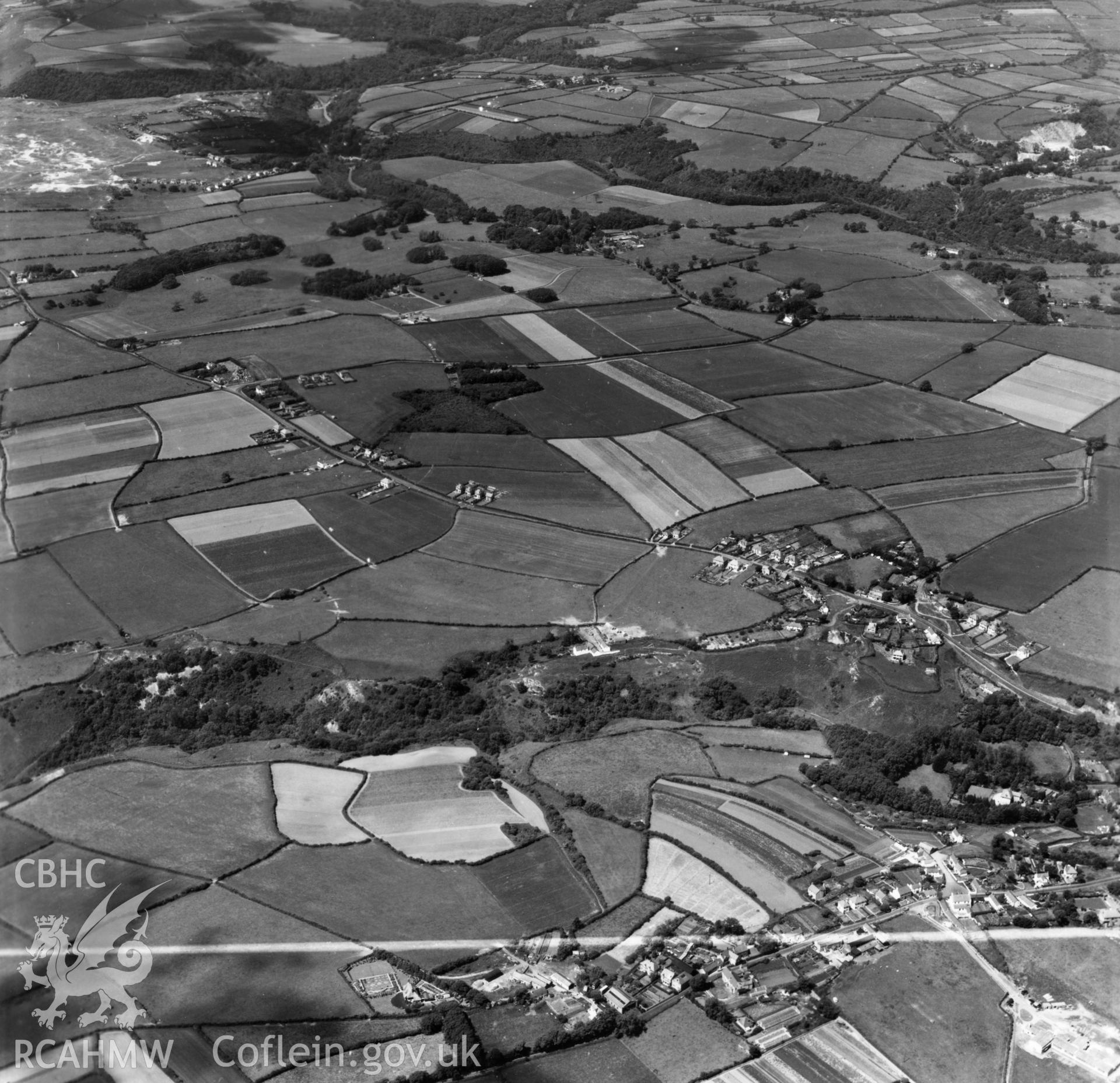 View down the Bishopston valley toward Pennard Burrows showing Kittle and Bishopston in foreground. Oblique aerial photograph, 5?" cut roll film.