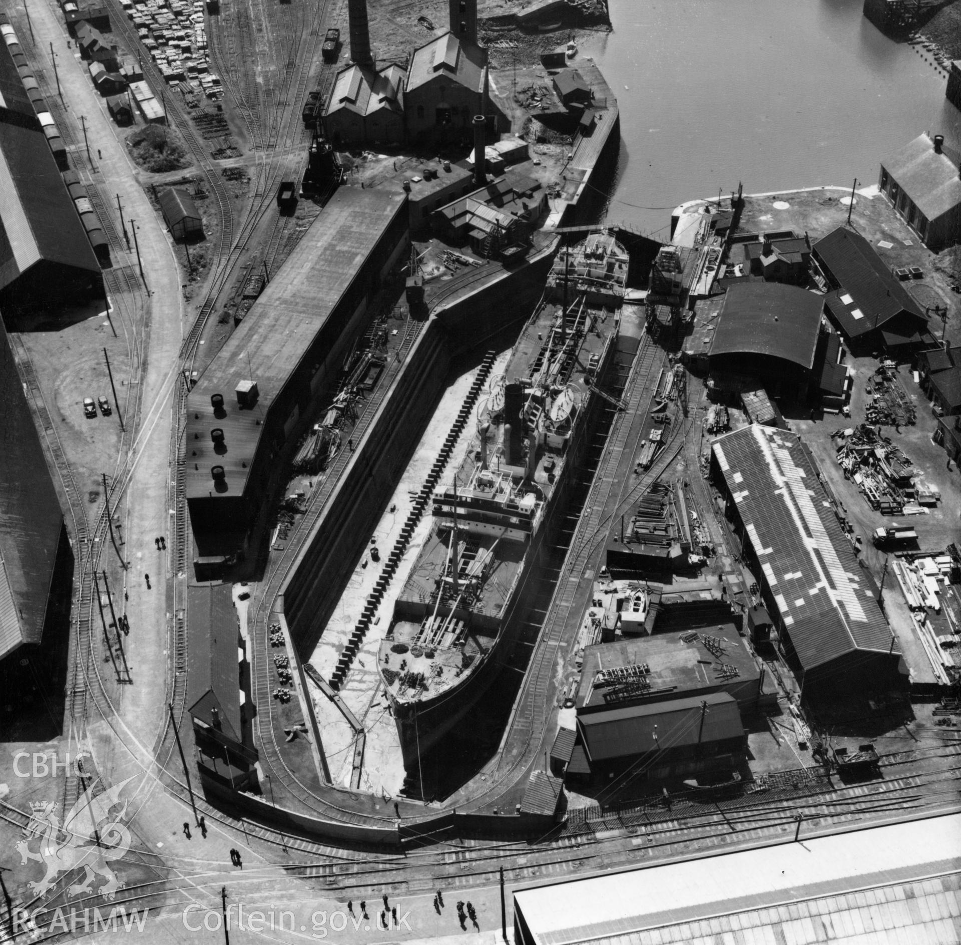 View of Prince of Wales dry dock, Swansea, showing the ship 'Pendeen' in dry dock. Oblique aerial photograph, 5?" cut roll film.