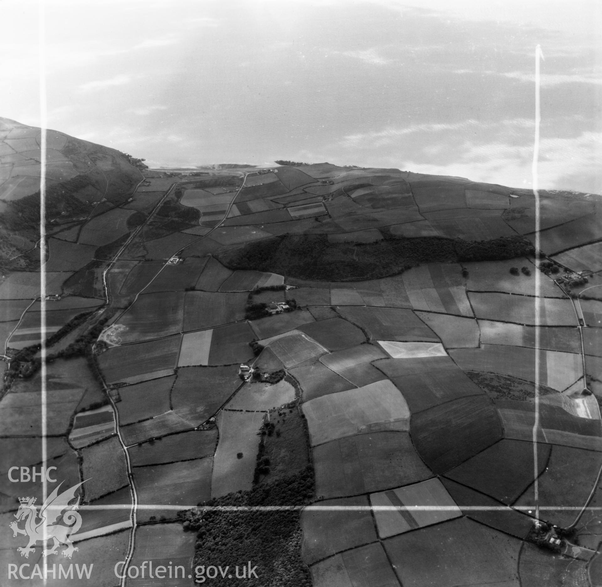 View of landscape inland of Clarach showing the Afon Clarach valley, commissioned by J.E. Nichols. Oblique aerial photograph, 5?" cut roll film.