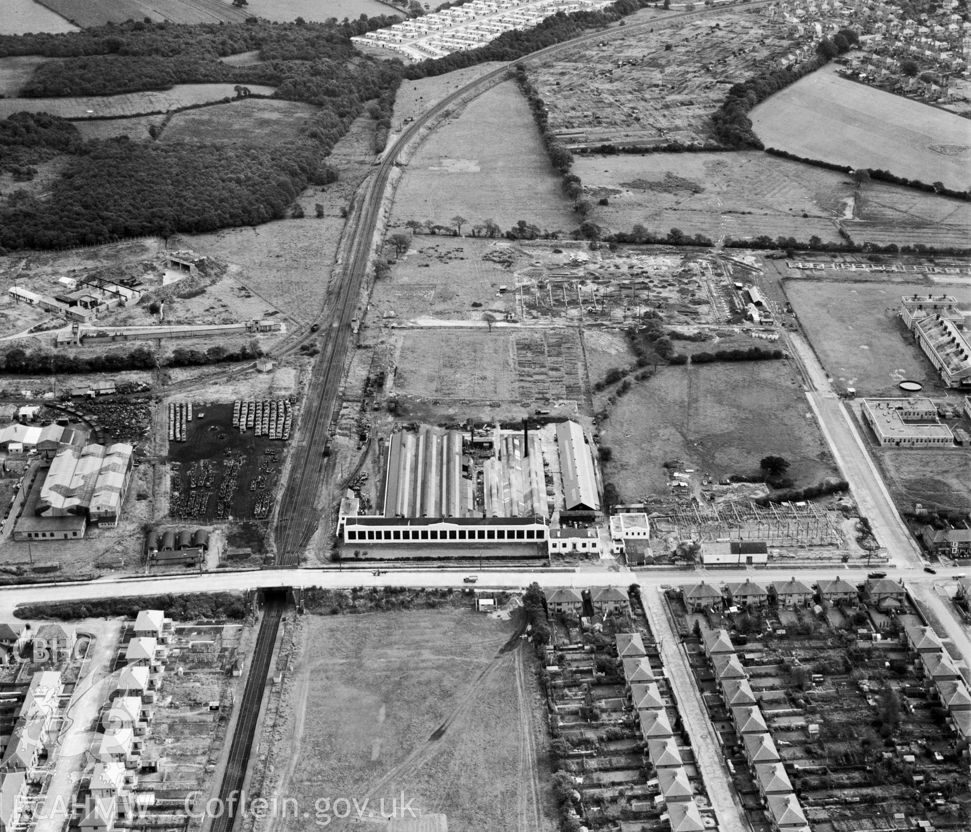 View of Morgan Rees & Sons Ltd. Whitchurch, showing redundant military armoured vehicles stored at the adjacent Royal Odnance Factory