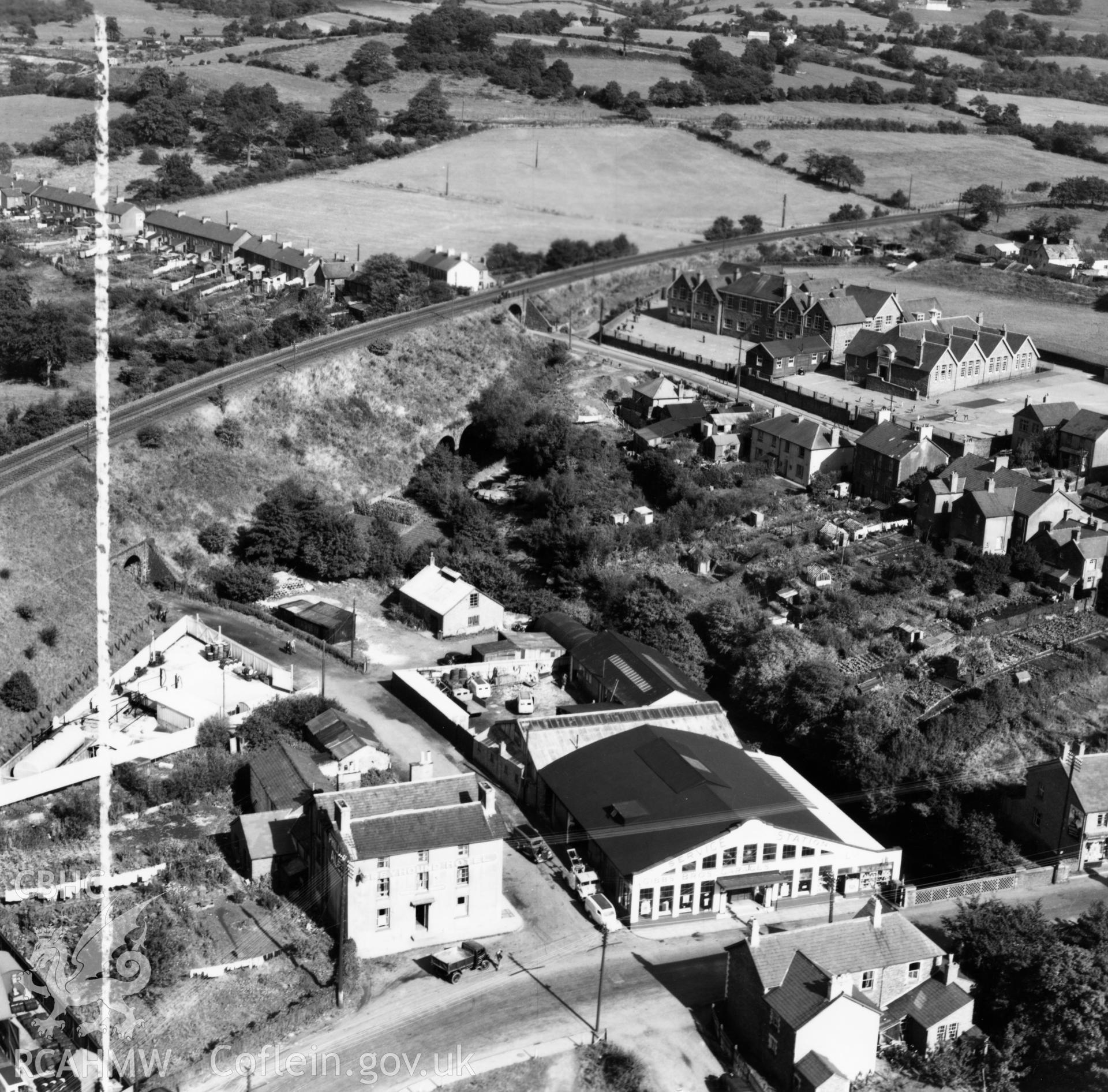 View of Gibbs Brothers garage at Pontllanfraith, also showing schools. Oblique aerial photograph, 5?" cut roll film.