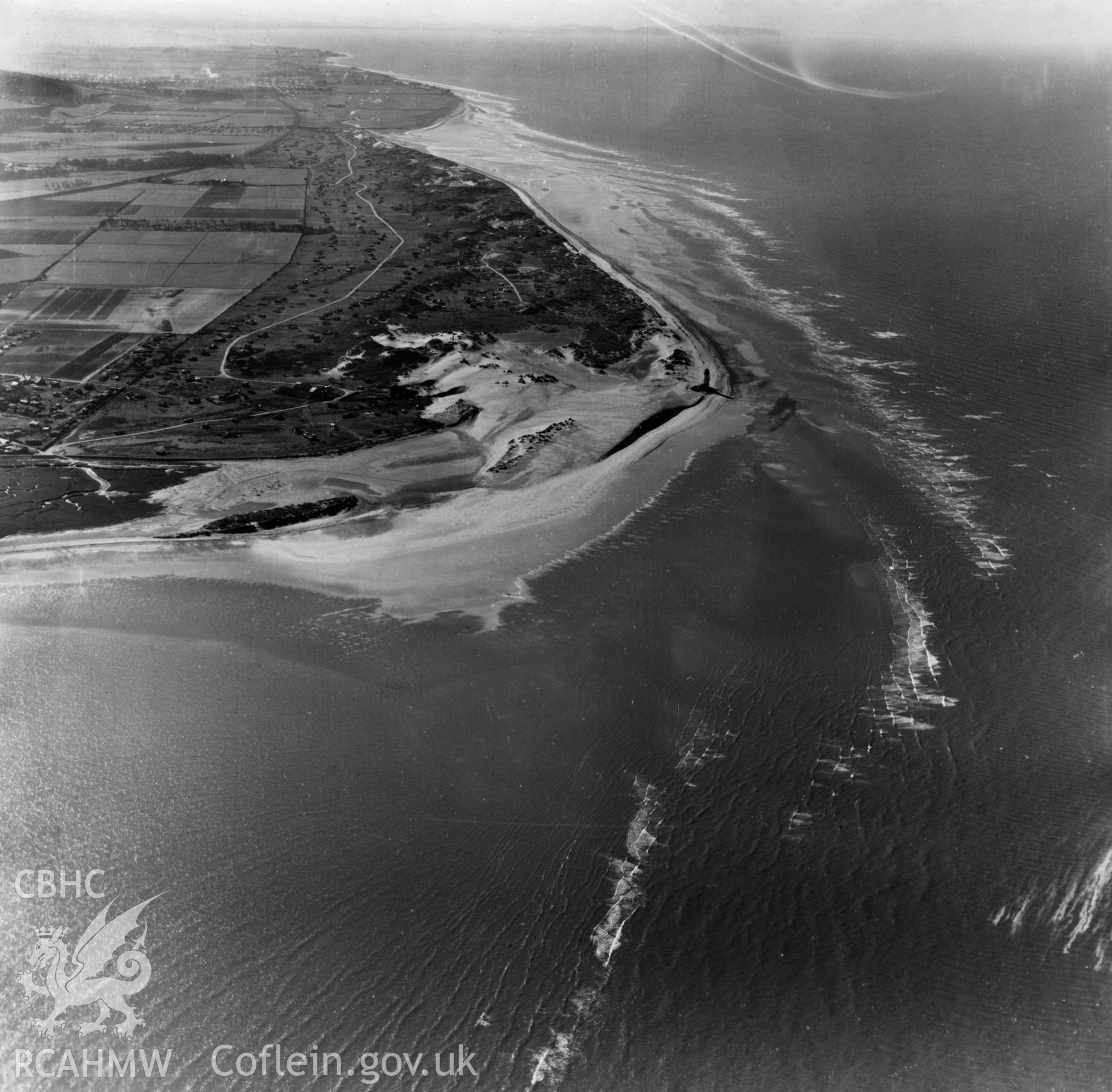 View of Point of Ayr lighthouse with caravans. Oblique aerial photograph, 5?" cut roll film.