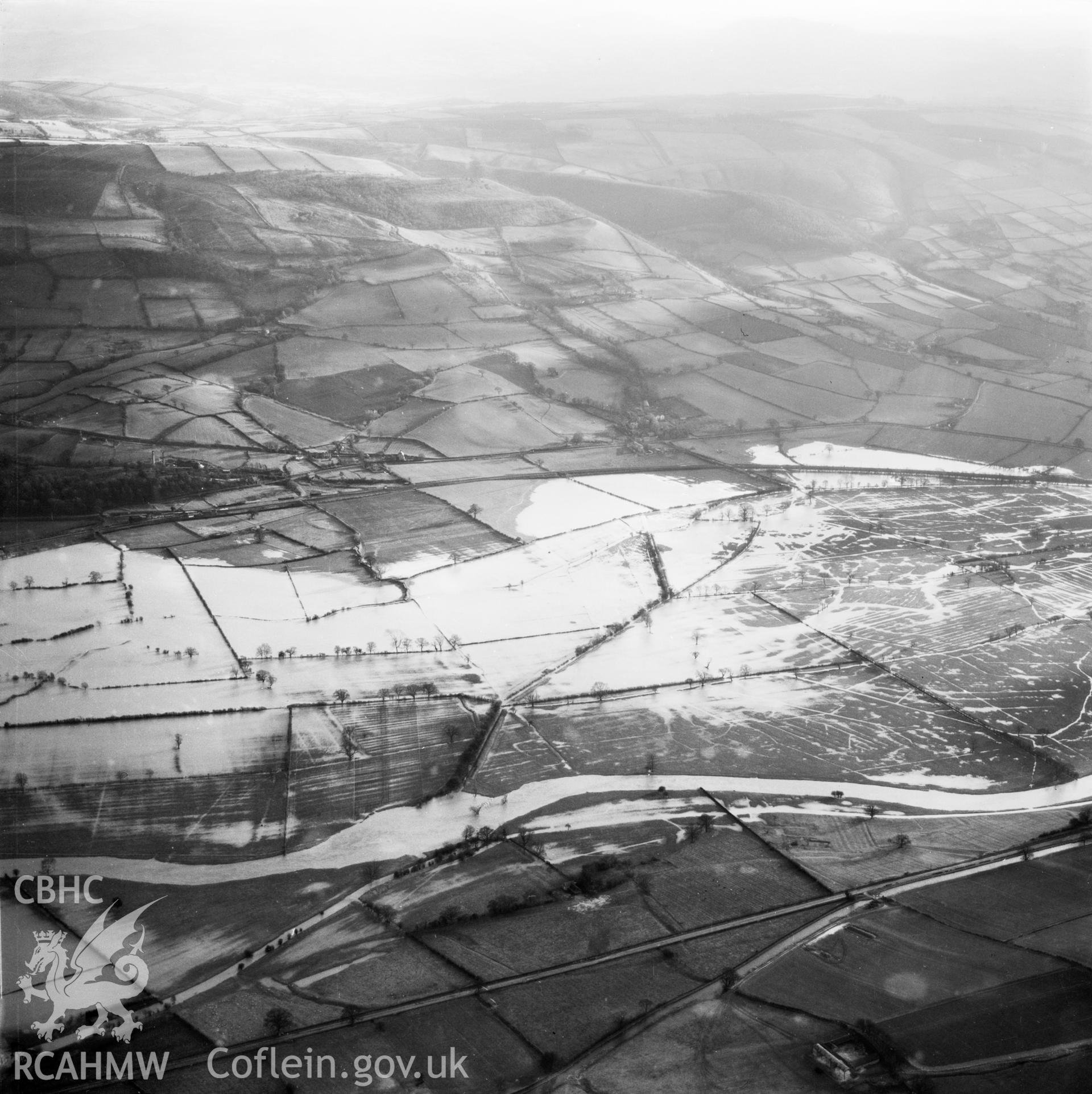 View of the river Severn in flood in the Criggion and Breiddan Hill area. Oblique aerial photograph, 5?" cut roll film.