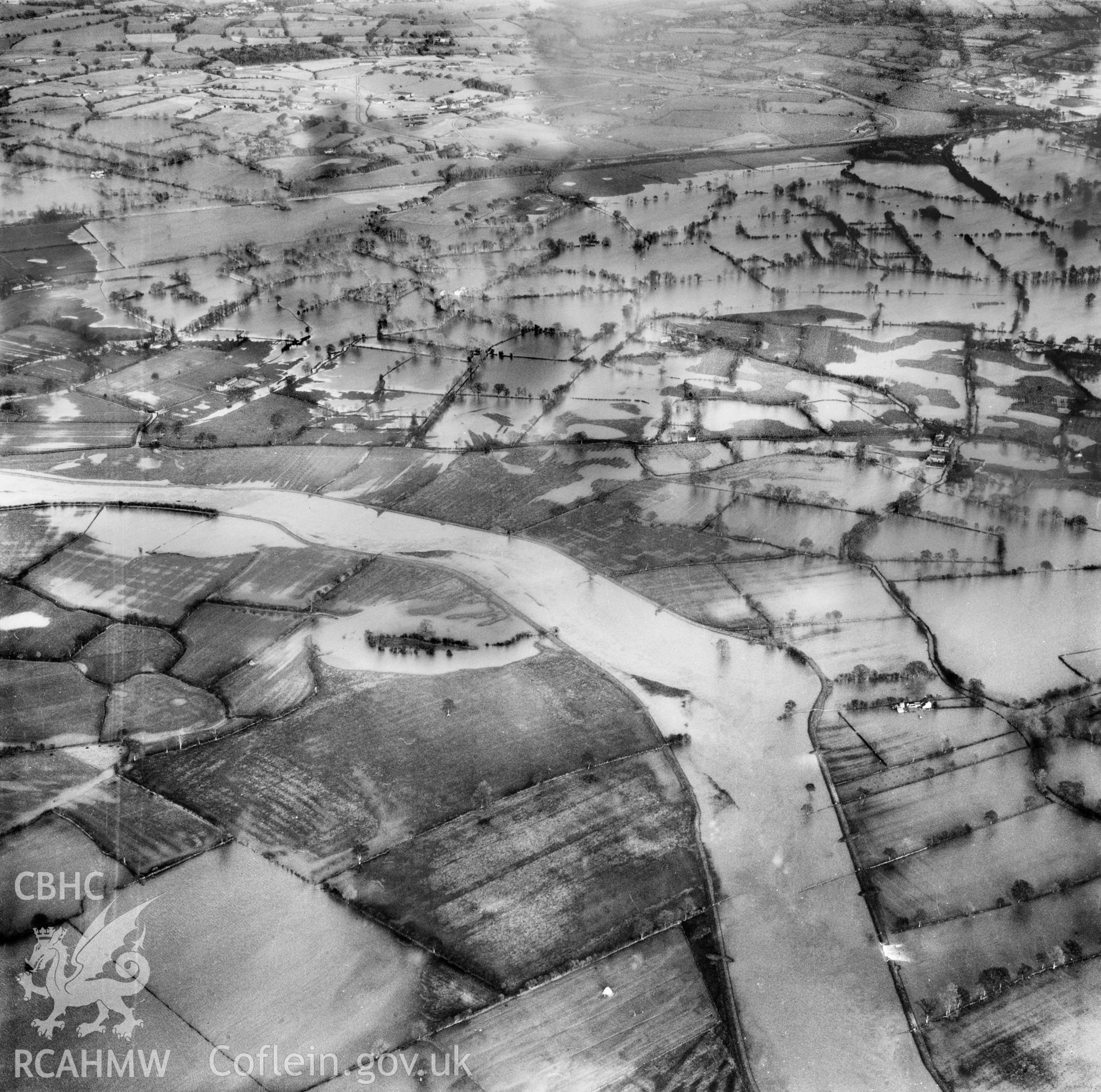 View of the river Severn in flood in the Criggion and Breiddan Hill area. Oblique aerial photograph, 5?" cut roll film.