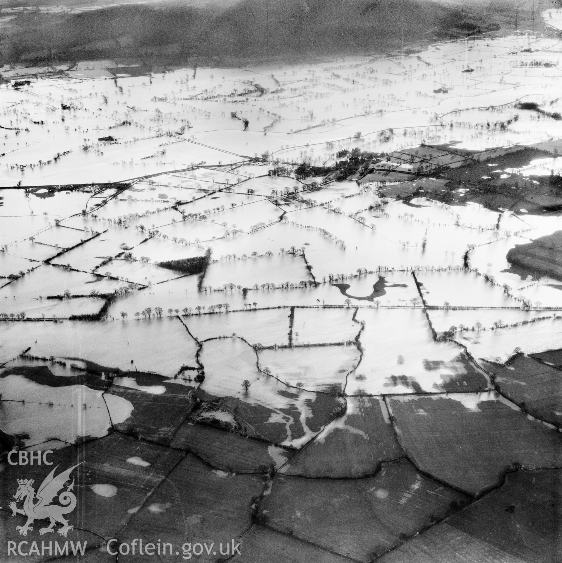 View of the river Severn in flood in the Criggion and Breiddan Hill area. Oblique aerial photograph, 5?" cut roll film.