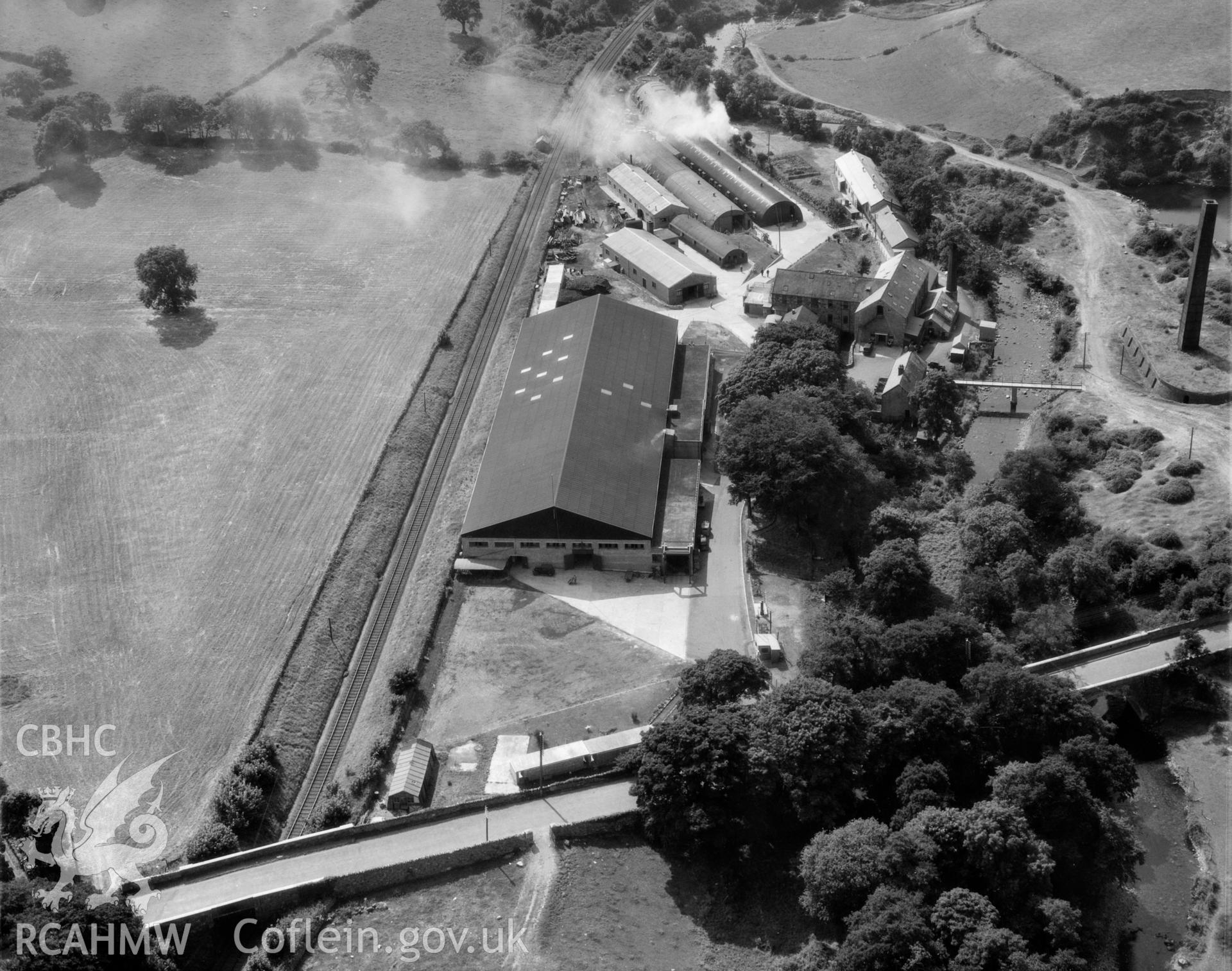 View of factory complex at Peblig Mill, Caernarfon, showing the mill, remains of brickworks, nissan huts and other works buildings