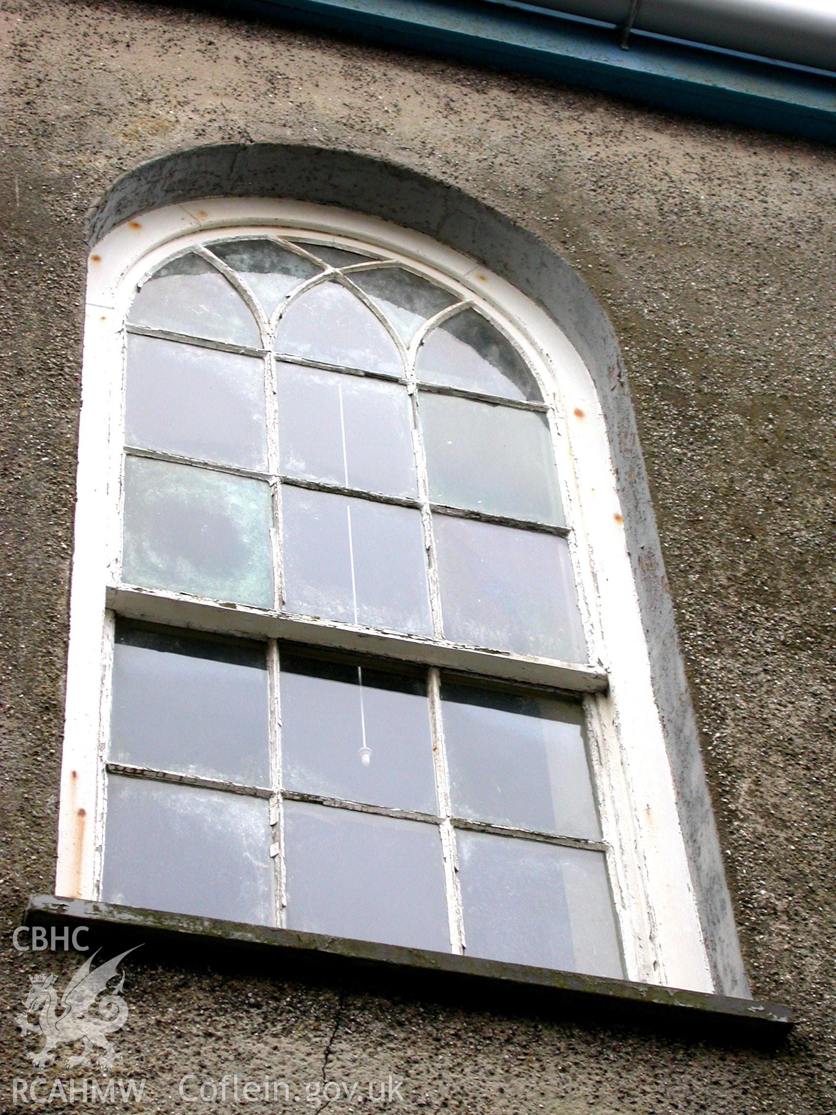 Interlacing tracery window, probably of 1826,on rear of chapel