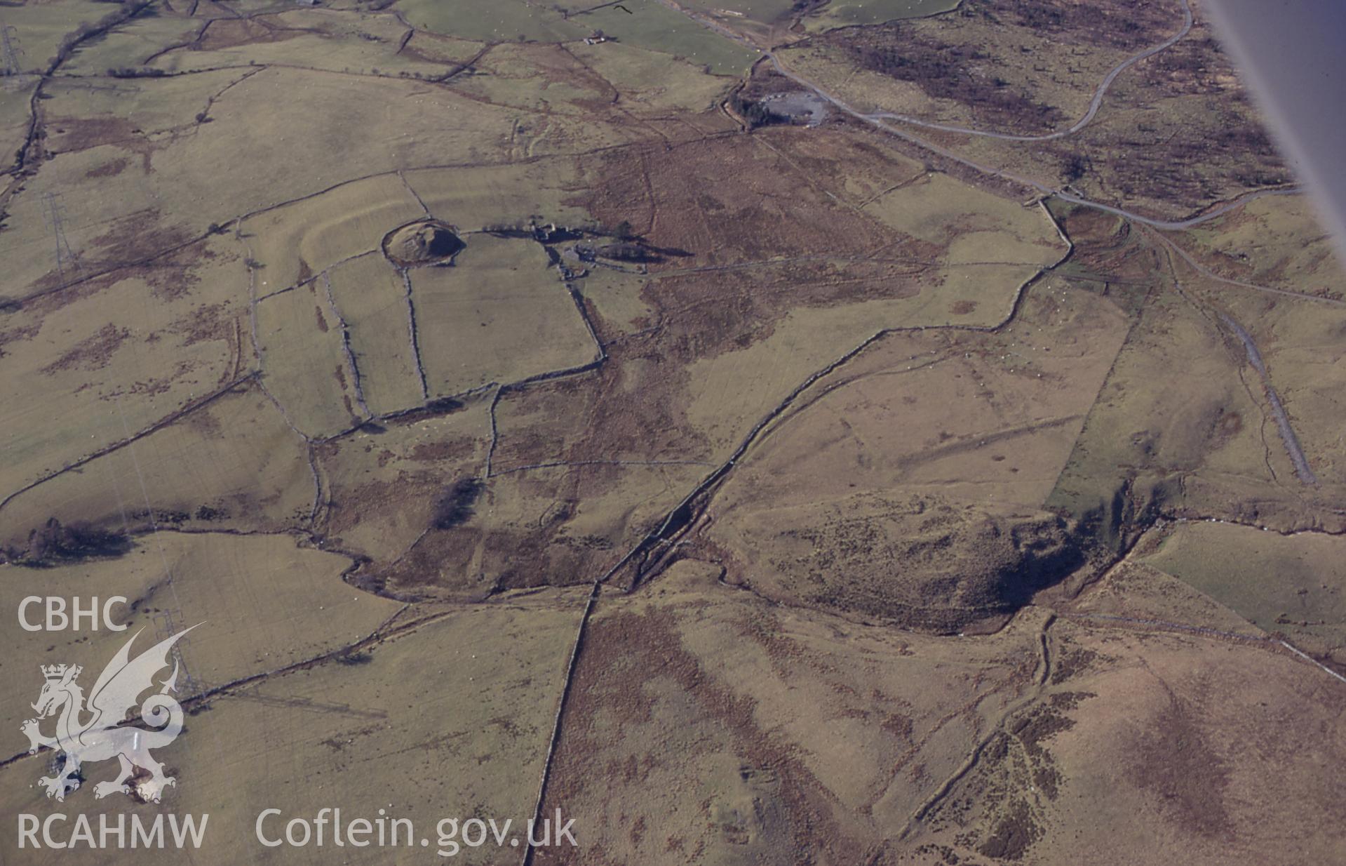 RCAHMW colour slide oblique aerial photograph of Tomen-y-mur (castell), Maentwrog, taken by C.R.Musson on the 30/03/1996