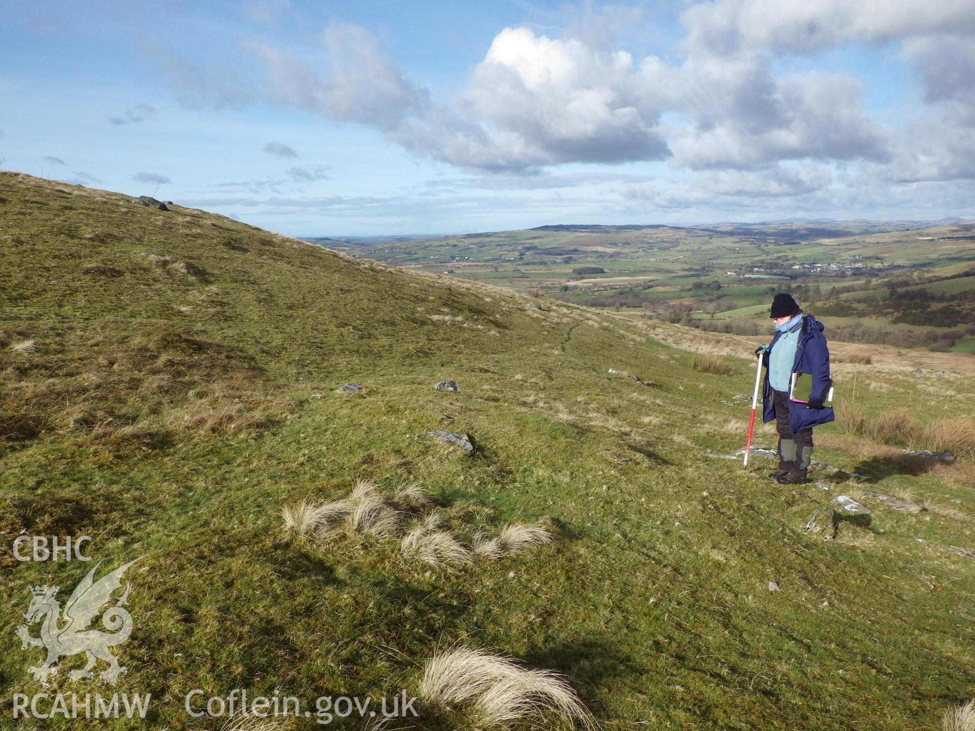 Grassed-over stone mound, looking north.
