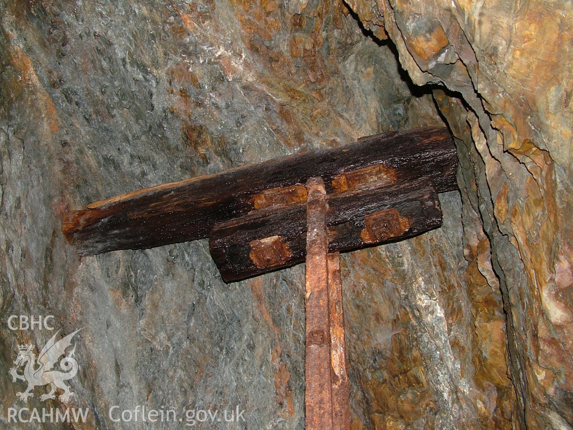 Wood and metal object in ceiling of adit