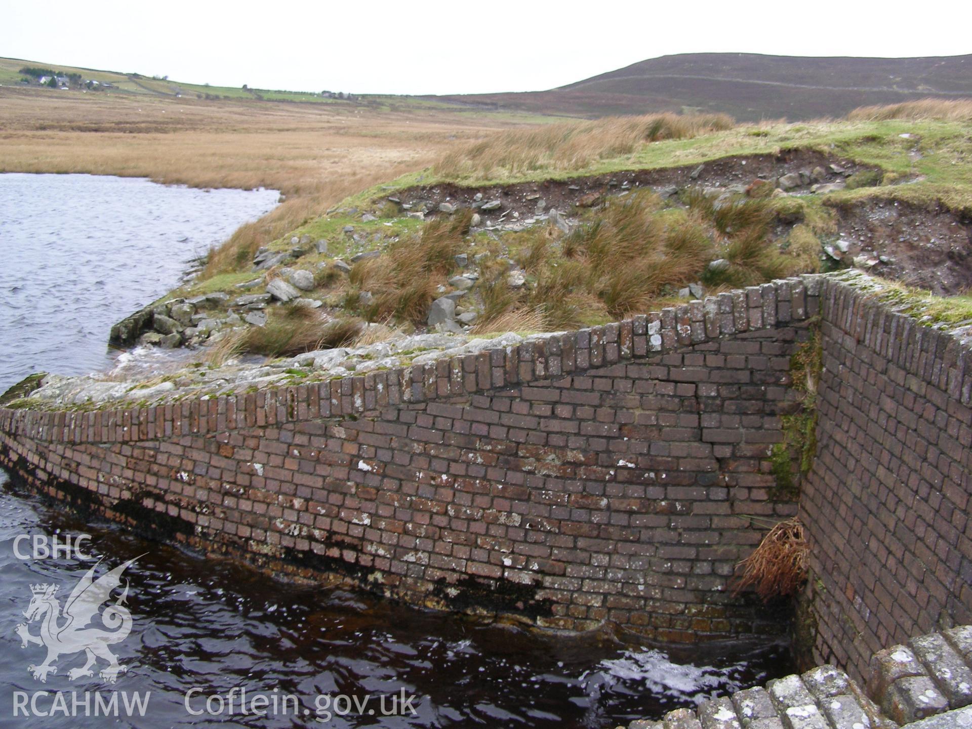 Digital colour photograph of a dam at Llyn y Mynydd taken on 22/01/2008 by P.J. Schofield during the Snowdonia Bethesda Upland Survey undertaken by Oxford Archaeology North.