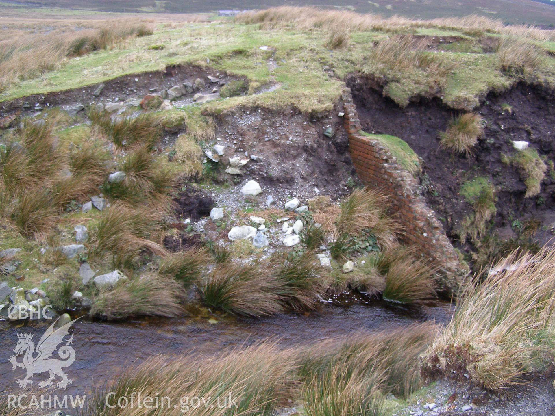 Digital colour photograph of a dam at Llyn y Mynydd taken on 22/01/2008 by P.J. Schofield during the Snowdonia Bethesda Upland Survey undertaken by Oxford Archaeology North.