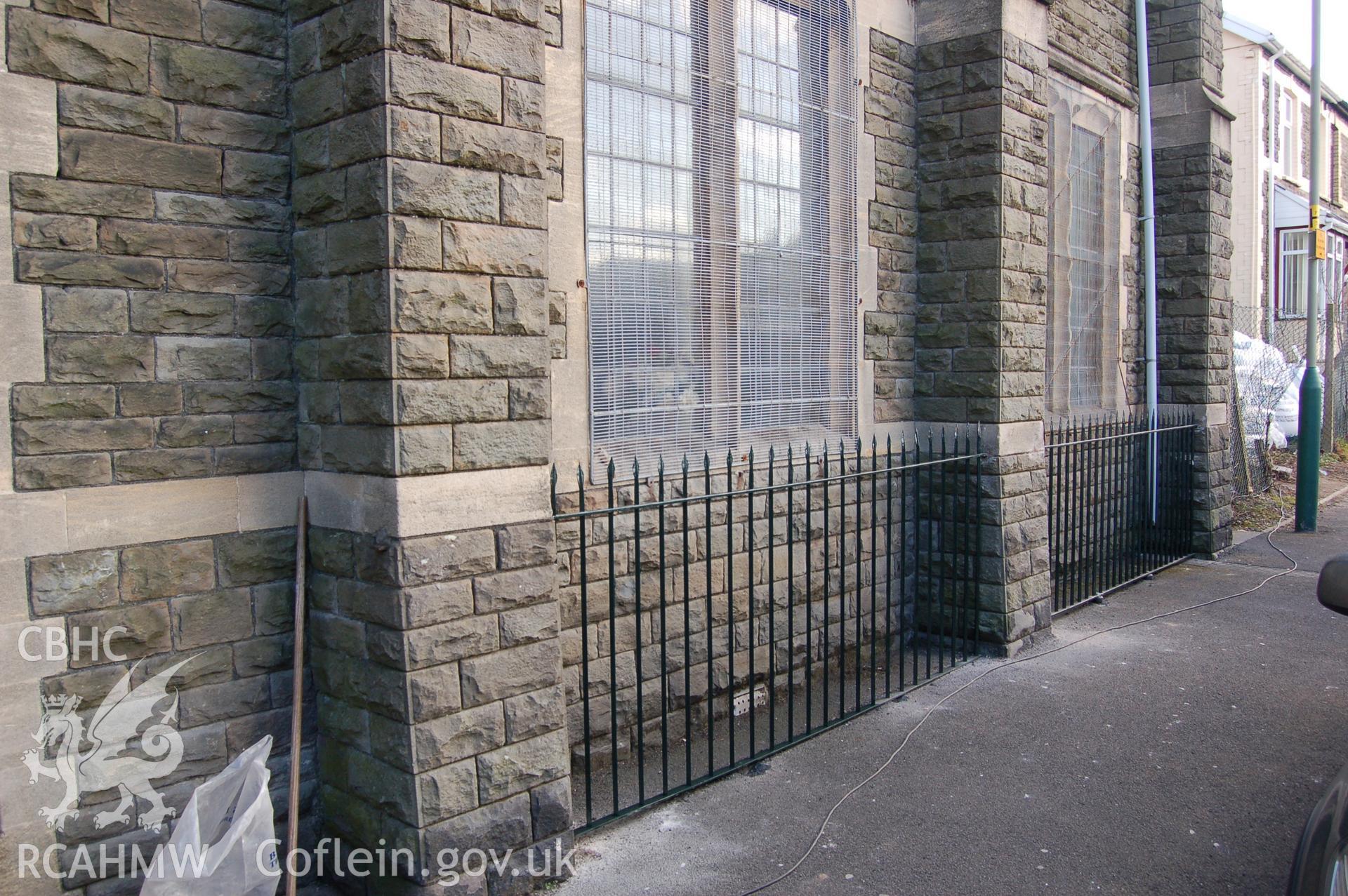 Digital colour photograph showing part of the railings outside Van Road United Reformed Church, after being painted.