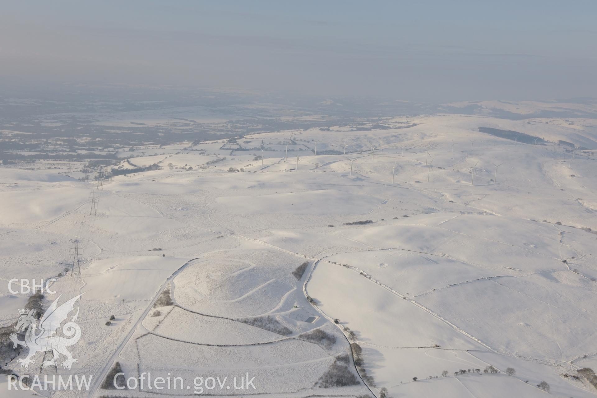 View from the east of Taff-Ely wind farm, Mynydd Maendy, north east of Bridgend. Oblique aerial photograph taken during the Royal Commission?s programme of archaeological aerial reconnaissance by Toby Driver on 24th January 2013.