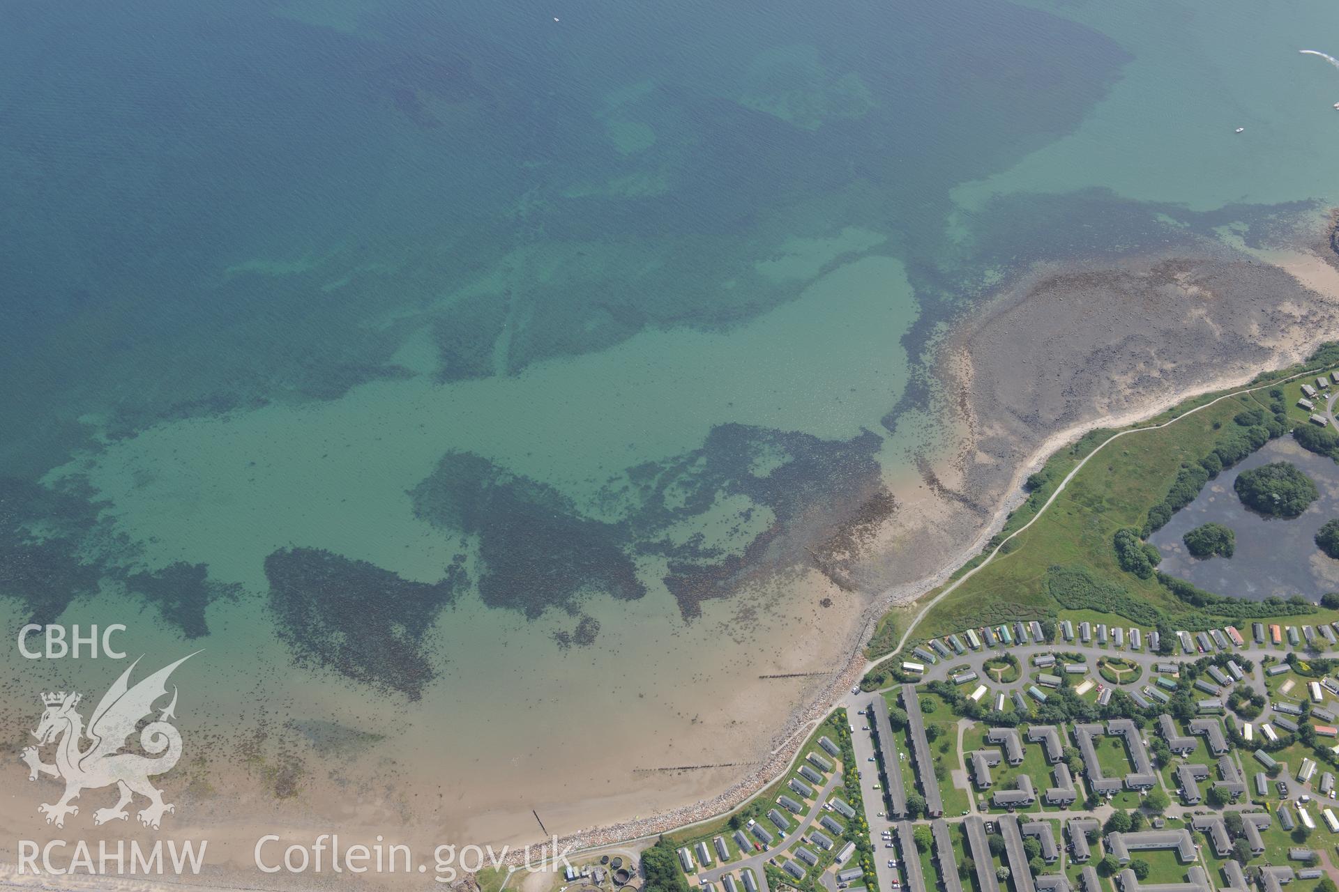 Hafan y Mor Holiday Park and Cerrig y Barcdy Fish Trap, Pwllheli. Oblique aerial photograph taken during the Royal Commission?s programme of archaeological aerial reconnaissance by Toby Driver on 12th July 2013.